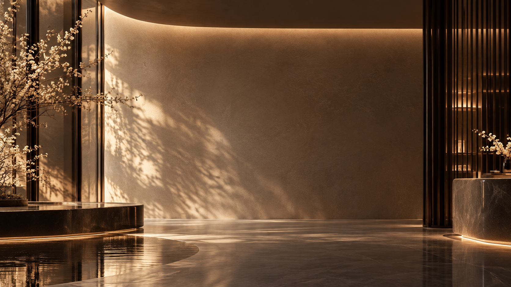 Modern interior lobby with warm lighting, flowering branches in vases, and reflective black marble surfaces.