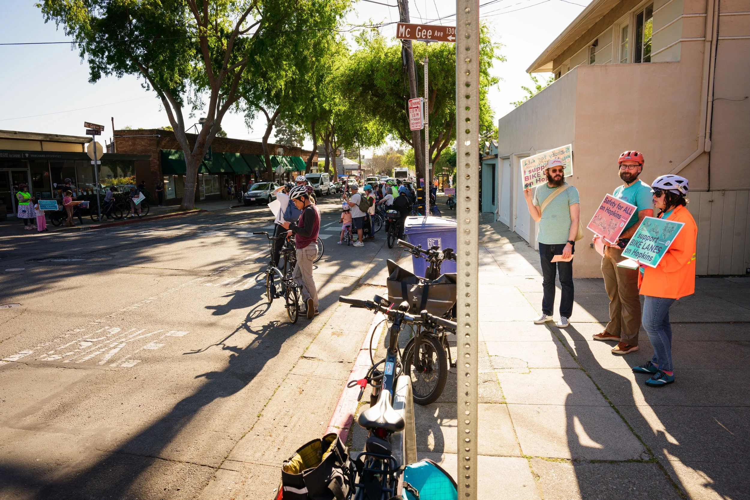 Cyclists line Hopkins Street in Berkeley, CA in support of a project to add a bidirectional cycle track on one side of street, a contentious issue within an aging community worried about preserving parking.