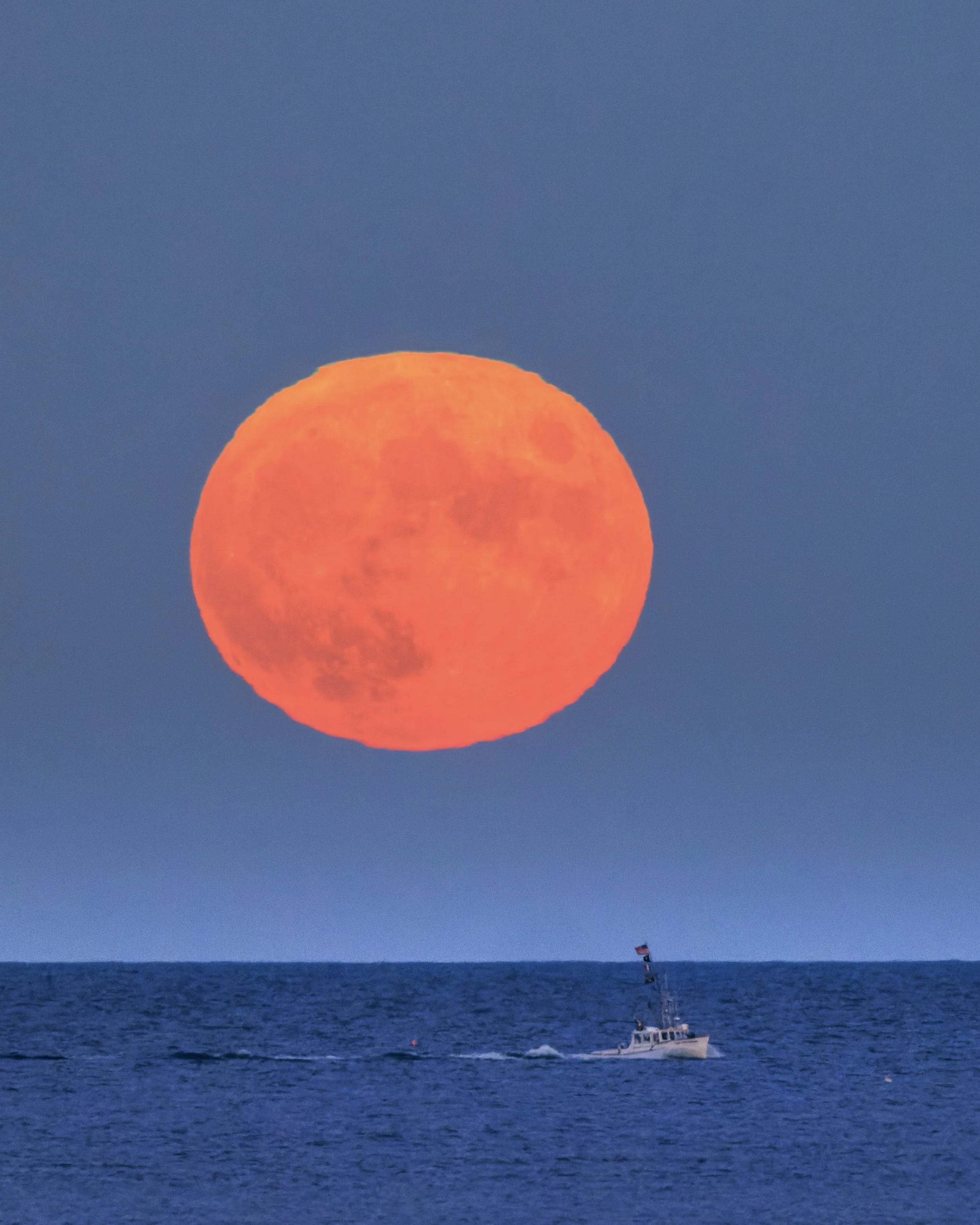 On the evening of October 9, the Massachusetts coastline was treated to the rise of the Hunter’s Moon, the full moon following the autumnal equinox. In Gloucester, a city defined by its relationship with the sea, this celestial event is an annual mar