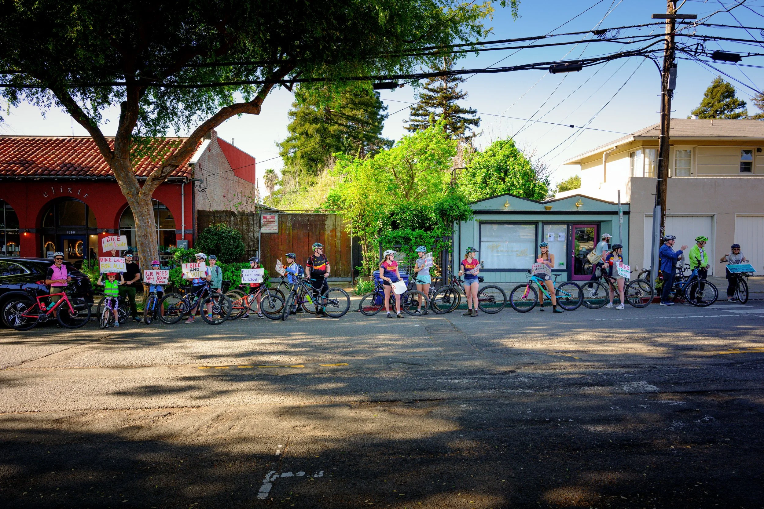 Cyclists line Hopkins Street in Berkeley, CA in support of a project to add a bidirectional cycle track on one side of street, a contentious issue within an aging community worried about preserving parking.