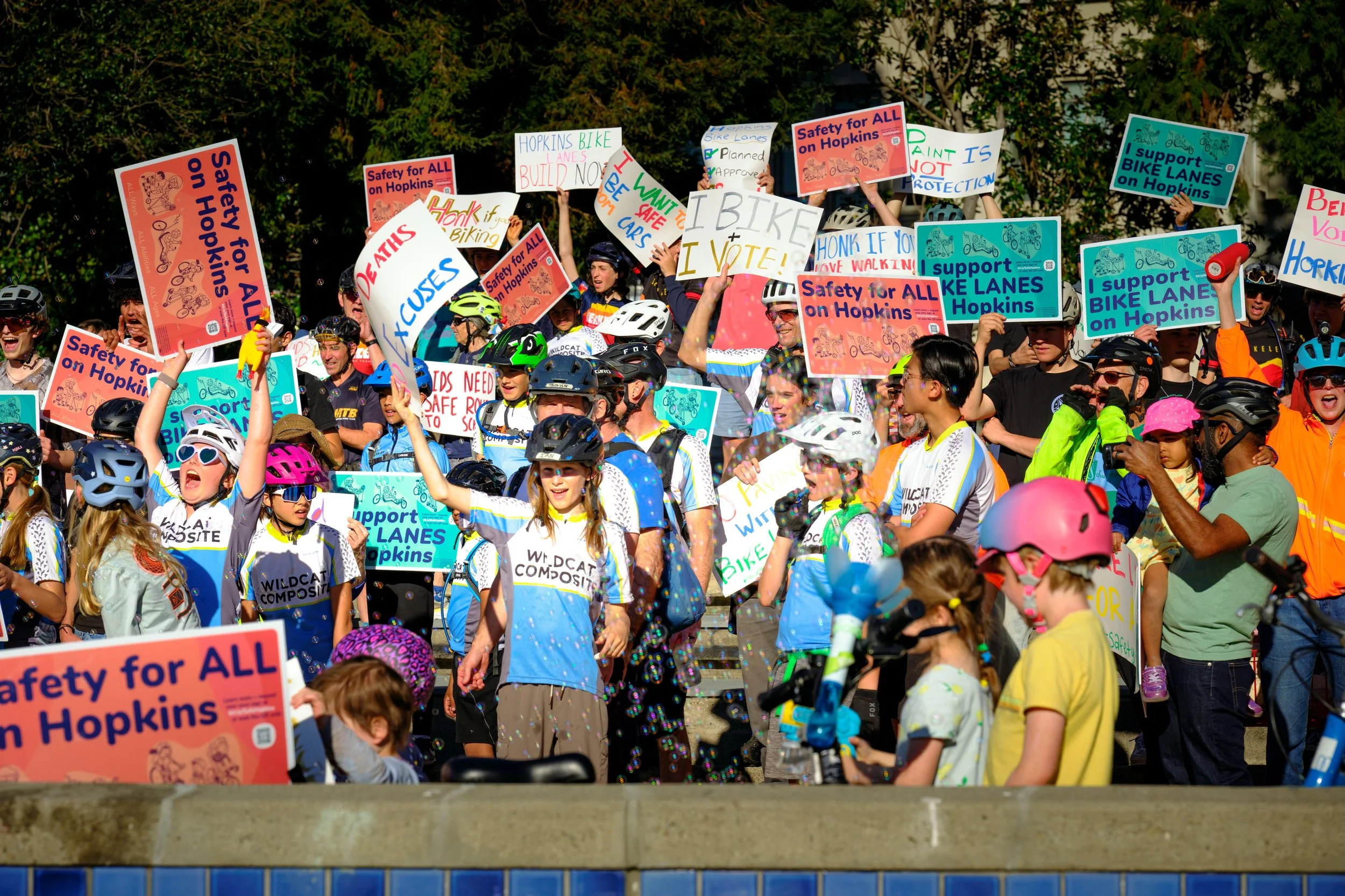 Local advocates pose for a picture to show support for the Hopkins Bike Lane project after cycling from Hopkins to City Hall in Berkeley, California.