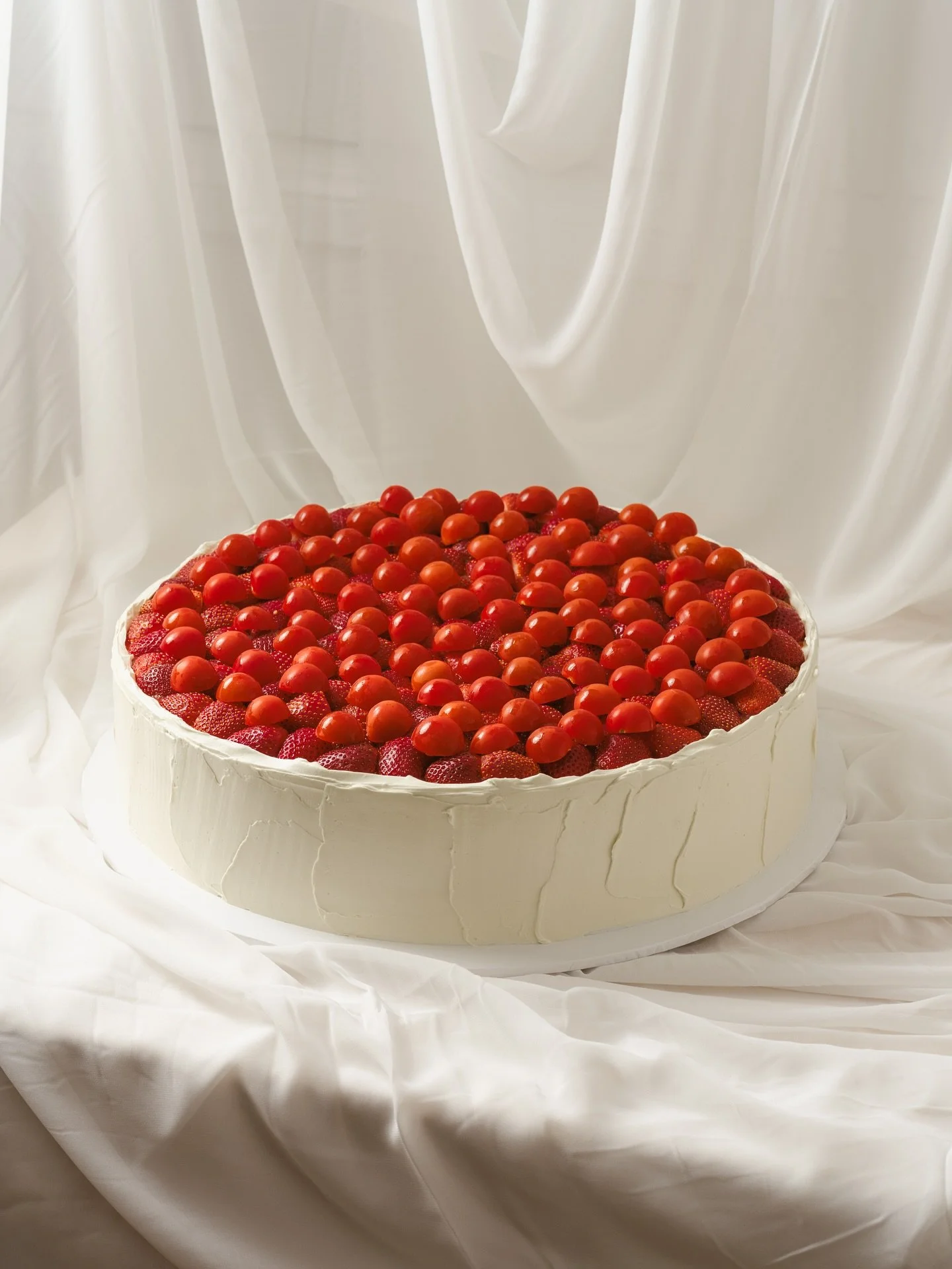 When Tom and Mary asked me to make their wedding cake, Mary had a vision - an oversized flat cake with monochrome fruits, but not just the usual raspberries. 

We played around with a few ideas (a citrus medley was in the running ), but she put her f