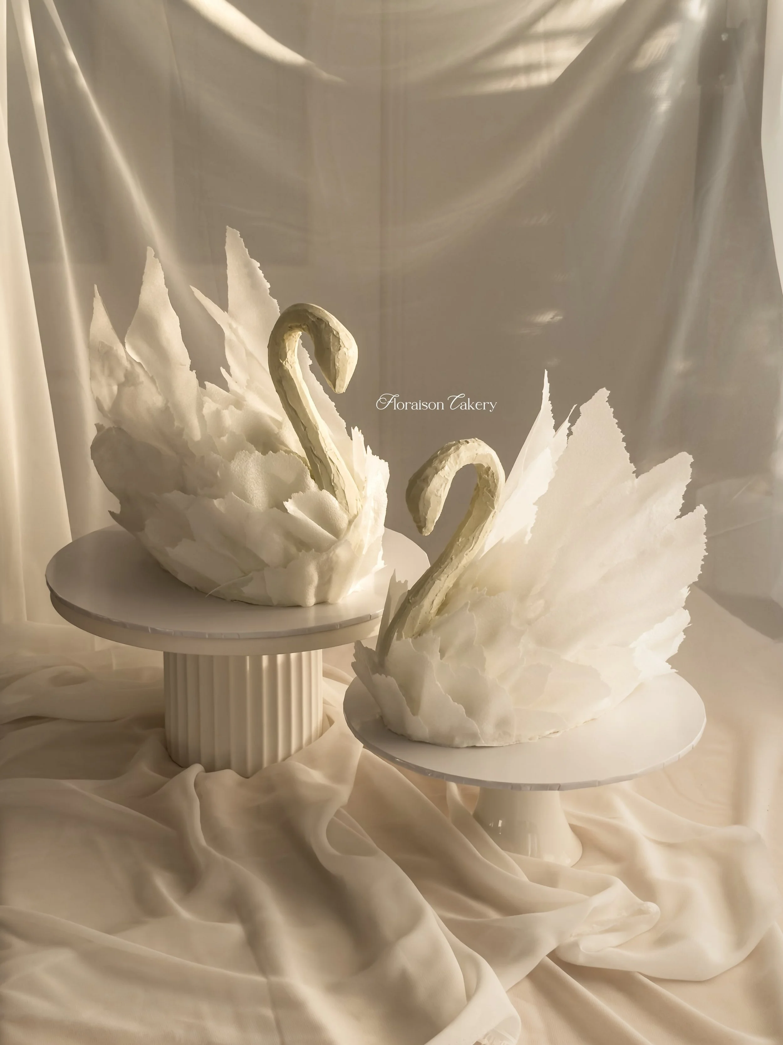 Swans mate for life 🦢

(most of the time; this pair didn&rsquo;t, since they were separate orders)

Our signature sculpted swan cake, available in two sizes:  large (left, serves up to 35) and small (right, serves up to 15).

Enquire via our link in