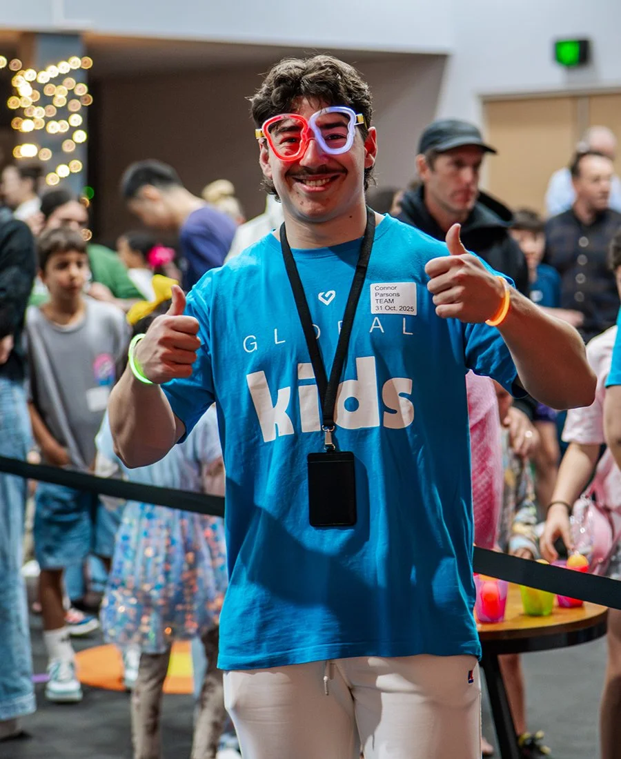 Global Kids Team member spending time with children