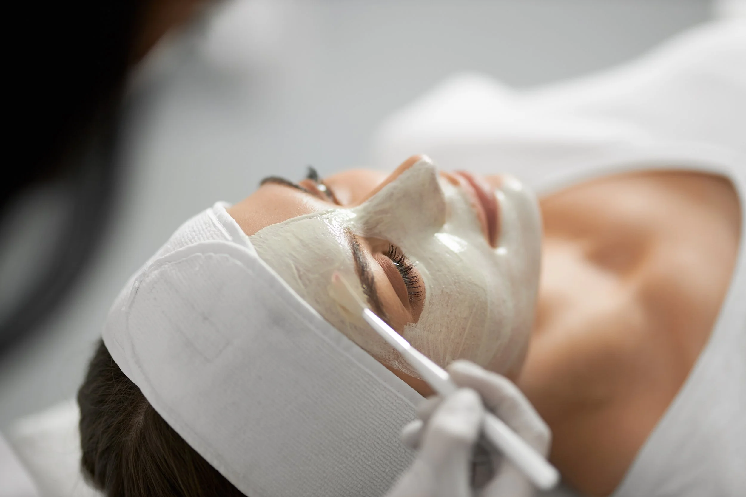 beautician-applying-special-white-mask-face-woman.jpg