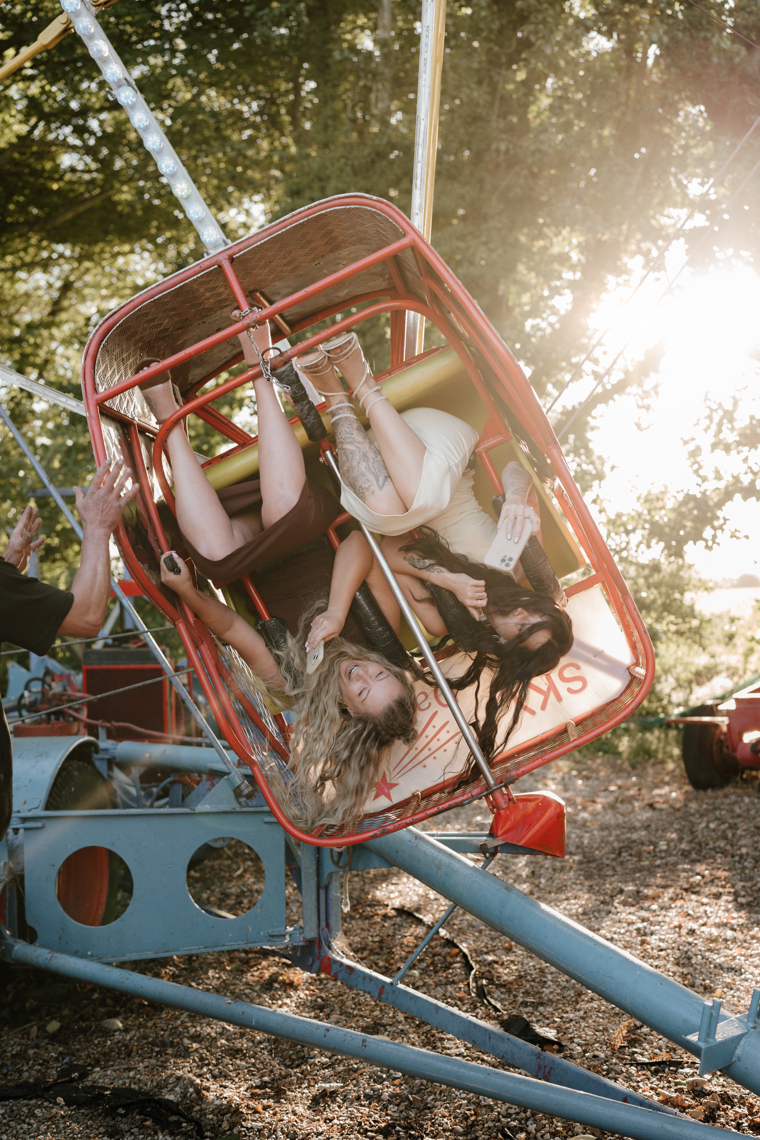 wedding guests having fun on a ferris wheel at marleybrook house in kent
