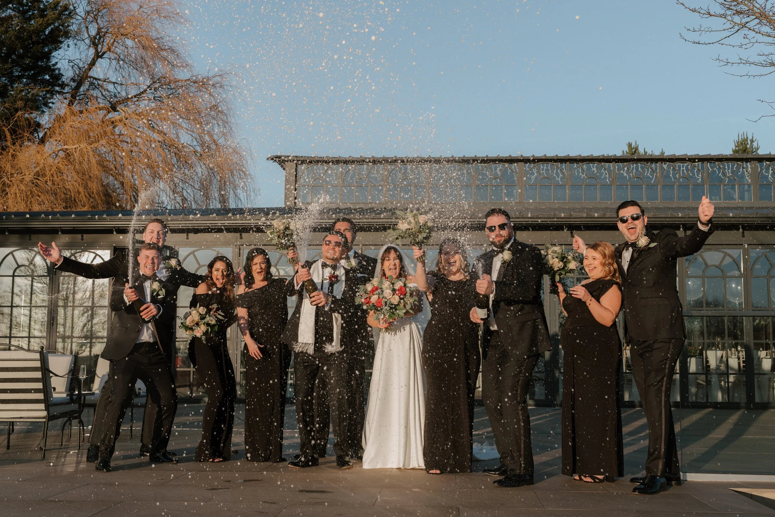 bridal party champagne spray at high house