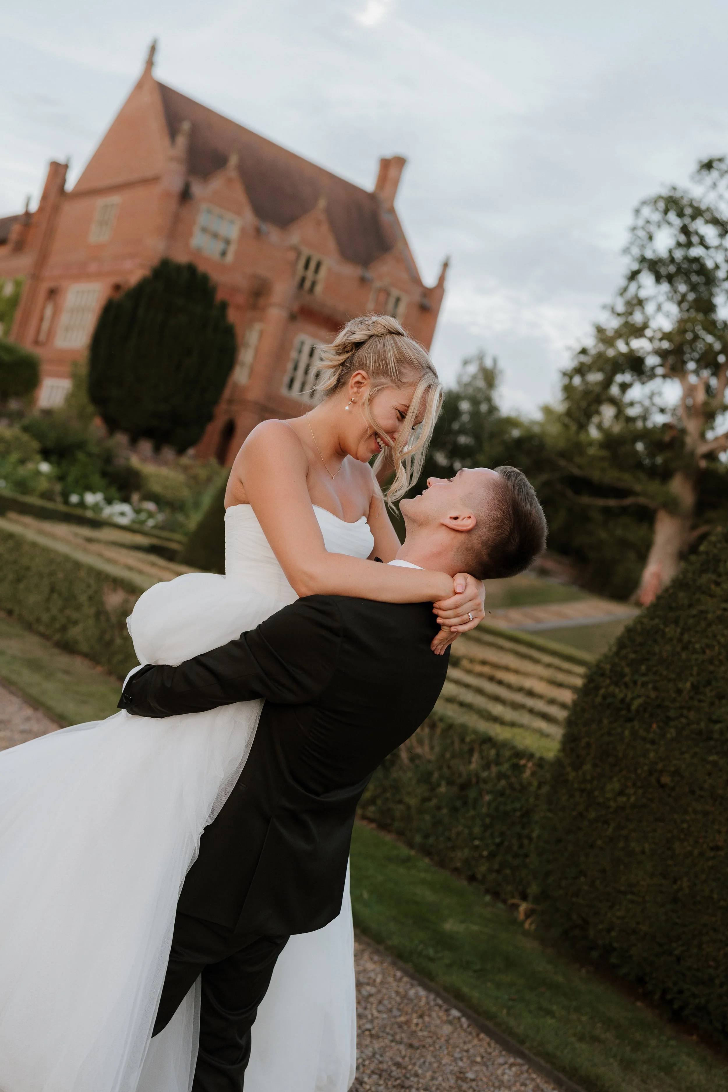 Bride & groom spin at oxnead hall at sunset
