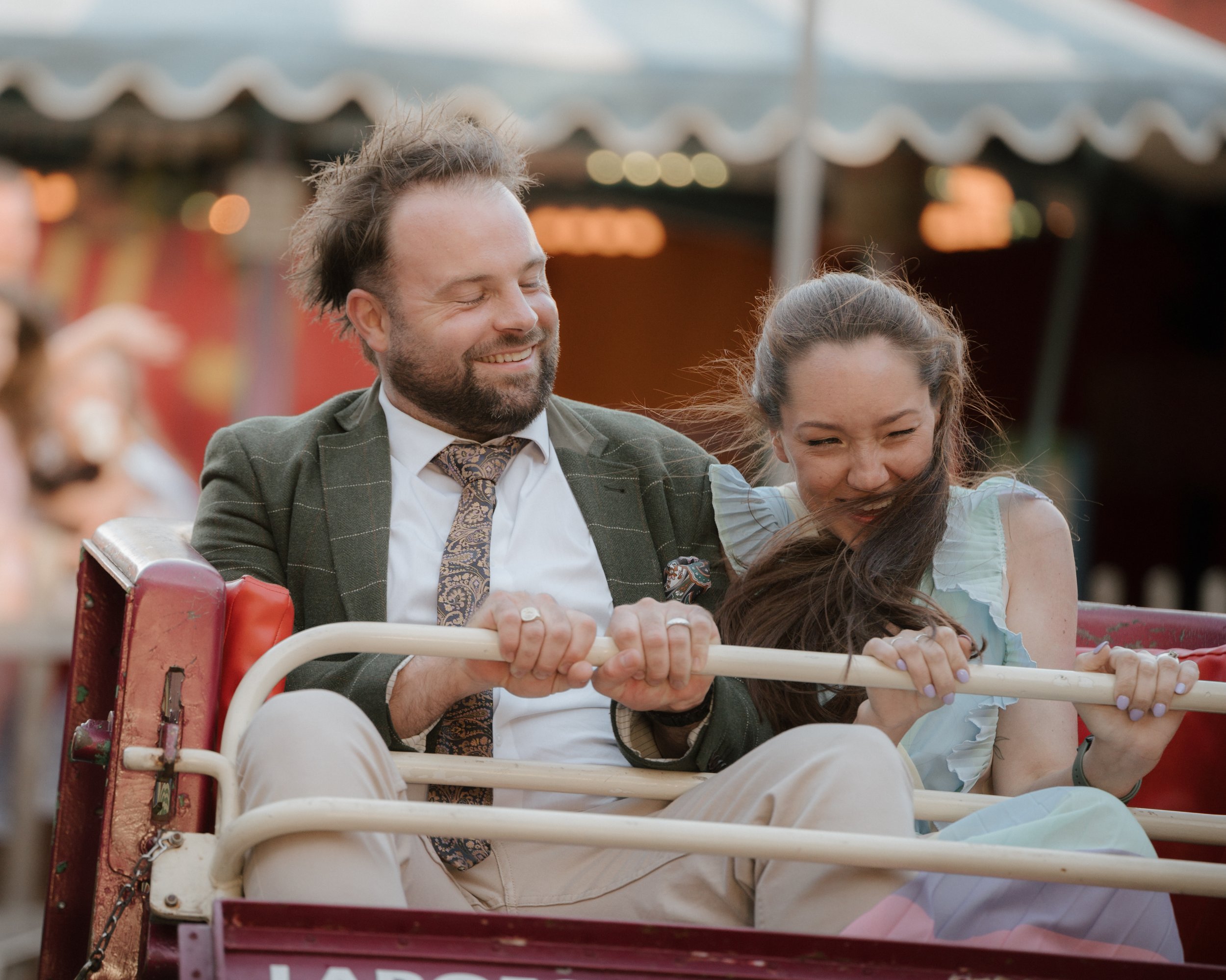 wedding guests having fun on the waltzers at marleybrook house wedding venue in kent
