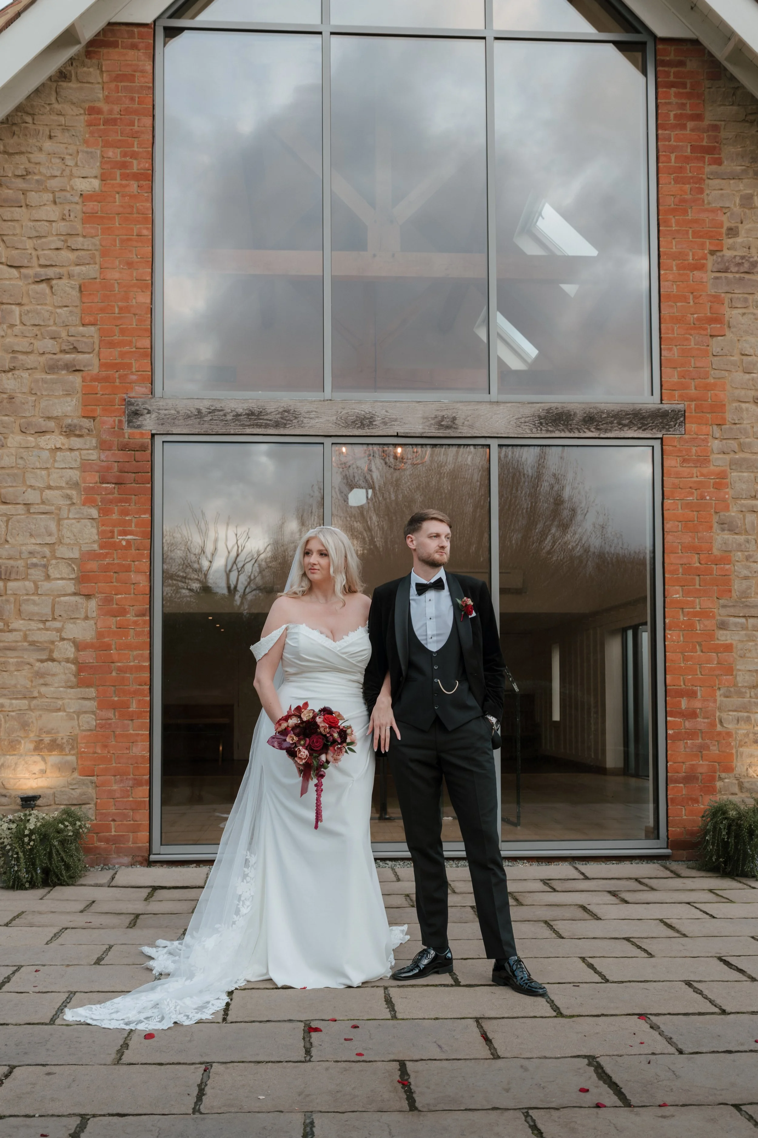 bride and groom editorial pose at luxury wedding venue millbridge court