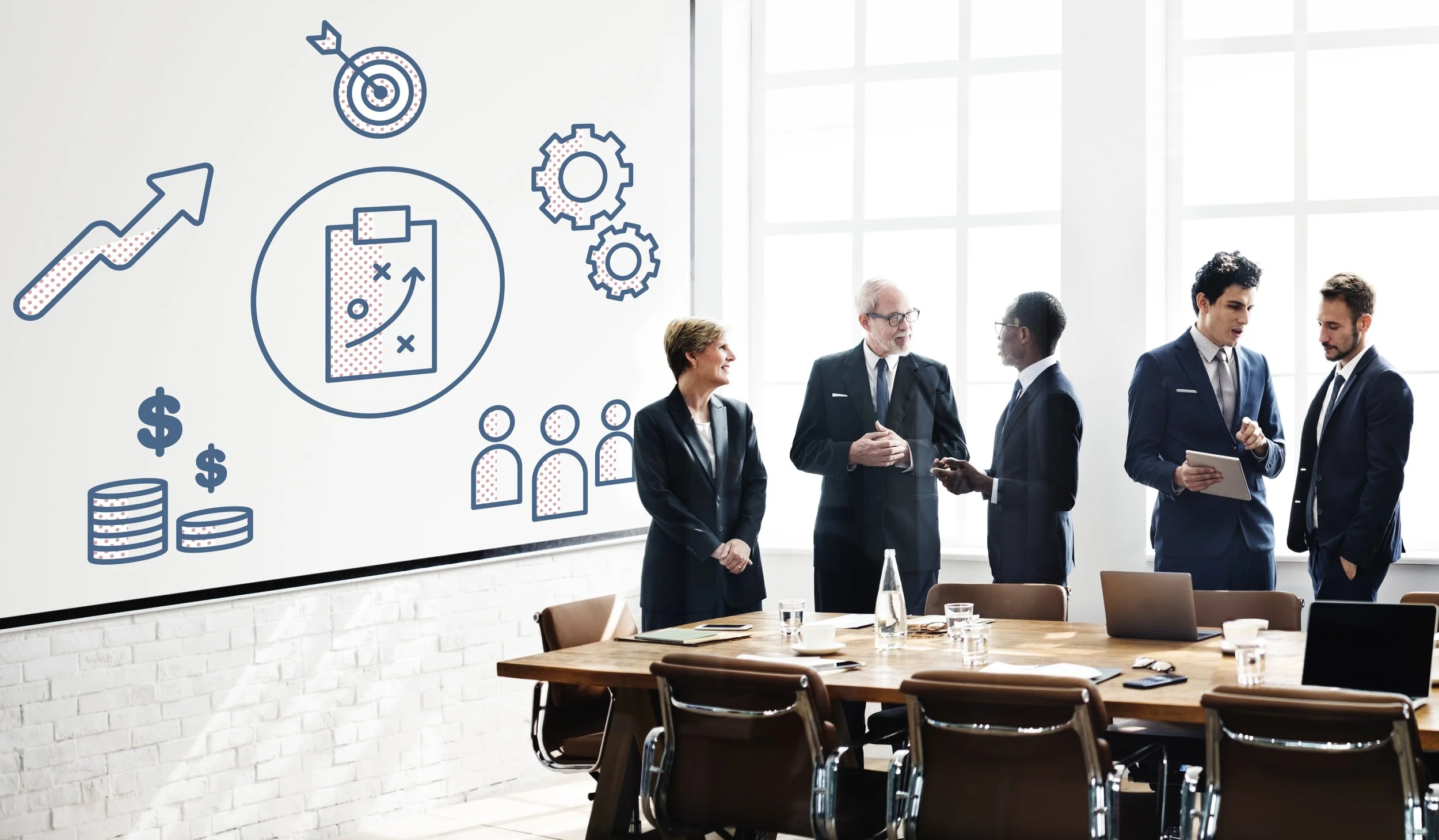 A business meeting or workshop with five professionals in formal attire talk and exchange ideas in a bright conference room. The room has a long wooden table with laptops, notebooks, and water bottles, and large windows allowing natural light. Overlaid on the left side are blue illustrations of a target, arrow, upward trend arrow, gears, dollar signs, coins, a strategy plan, and a team icon.