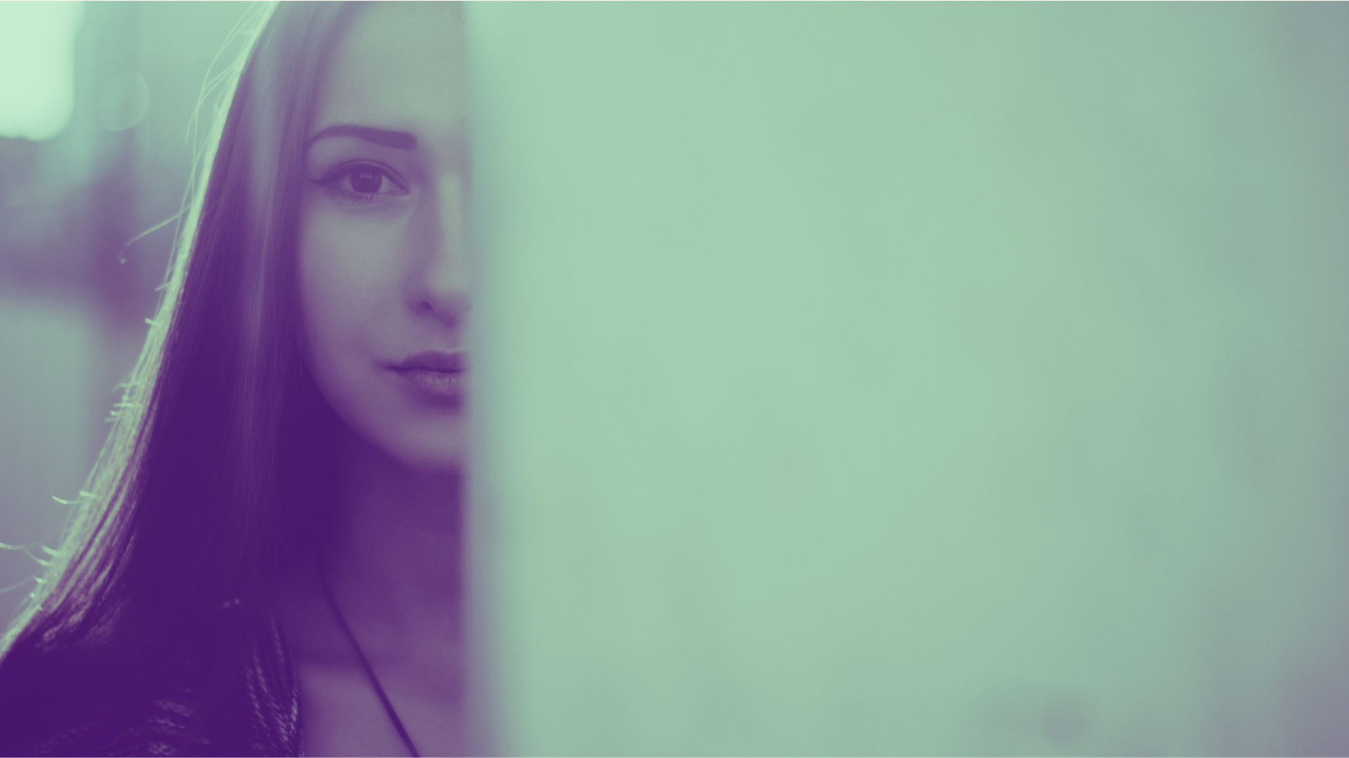 Photo of woman peering around a corner