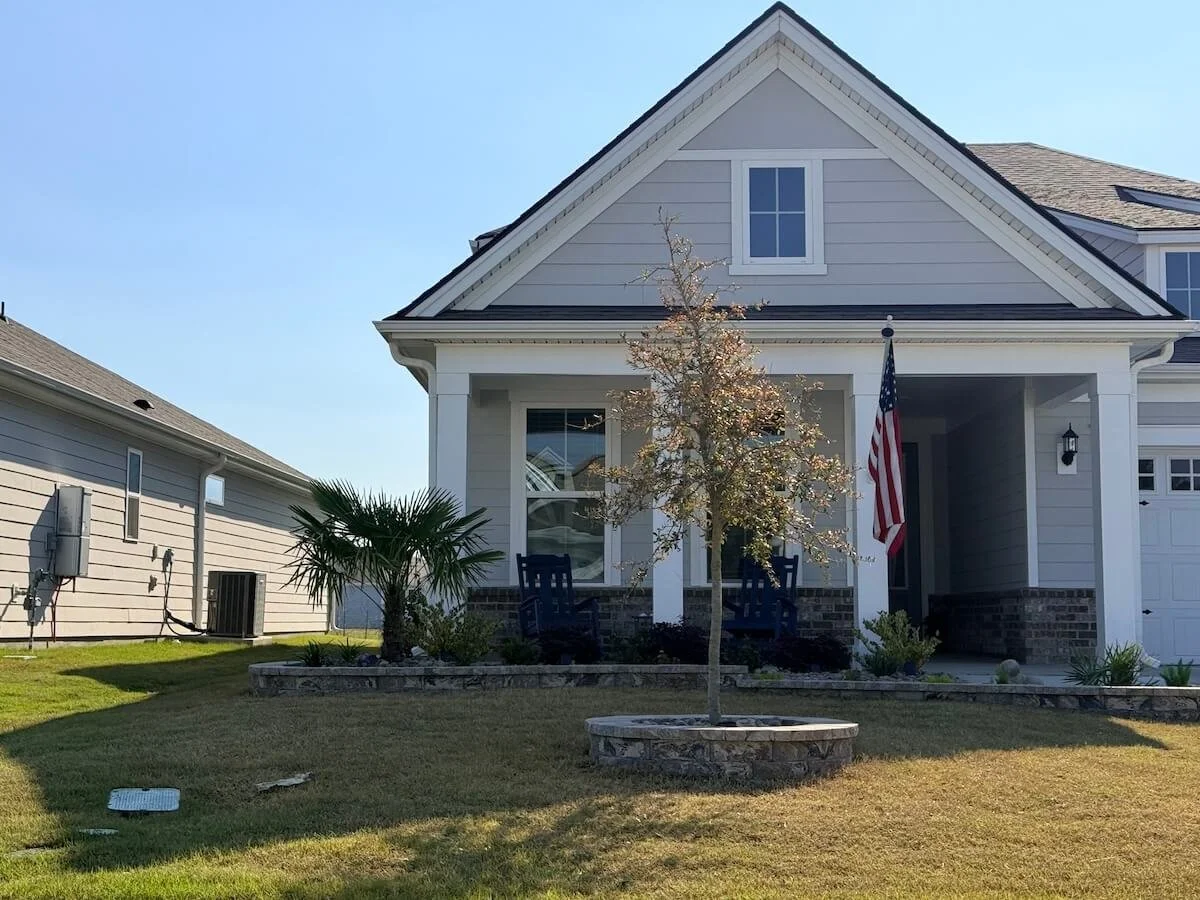 Suncity Bluffton home where New Vision Landscaping installed new stonework planter walls and new plants. 