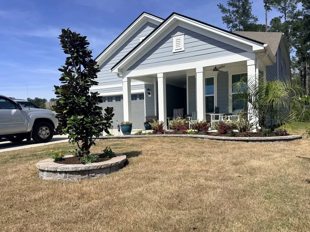 Suncity Bluffton home where New Vision Landscaping installed stonework and planters. 