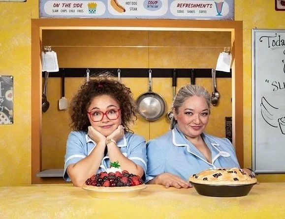 WAITRESS the Broadway musical by Sara Bareilles at Diamond Head Theatre in Honolulu, Hawaii. Becky and Dawn in the diner with pies. Cassie Favreau-Chung (Becky) and Karese Kaw-uh (Dawn).