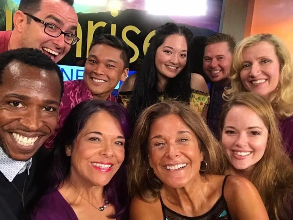 RISE UP: A BENEFIT CONCERT BY MELINA LILLIOS at Paliku Theatre in Kaneohe, Hawaii. Group of nine diverse smiling people taking a selfie at Hawaii News Now Sunrise morning news show.