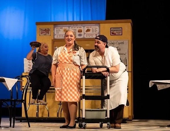 Finale of WAITRESS the Broadway musical by Sara Bareilles at Diamond Head Theatre. Becky and Cal in the diner. Cassie Favreau-Chung (Becky) and Don Farmer (Cal). "Opening Up (Finale)"