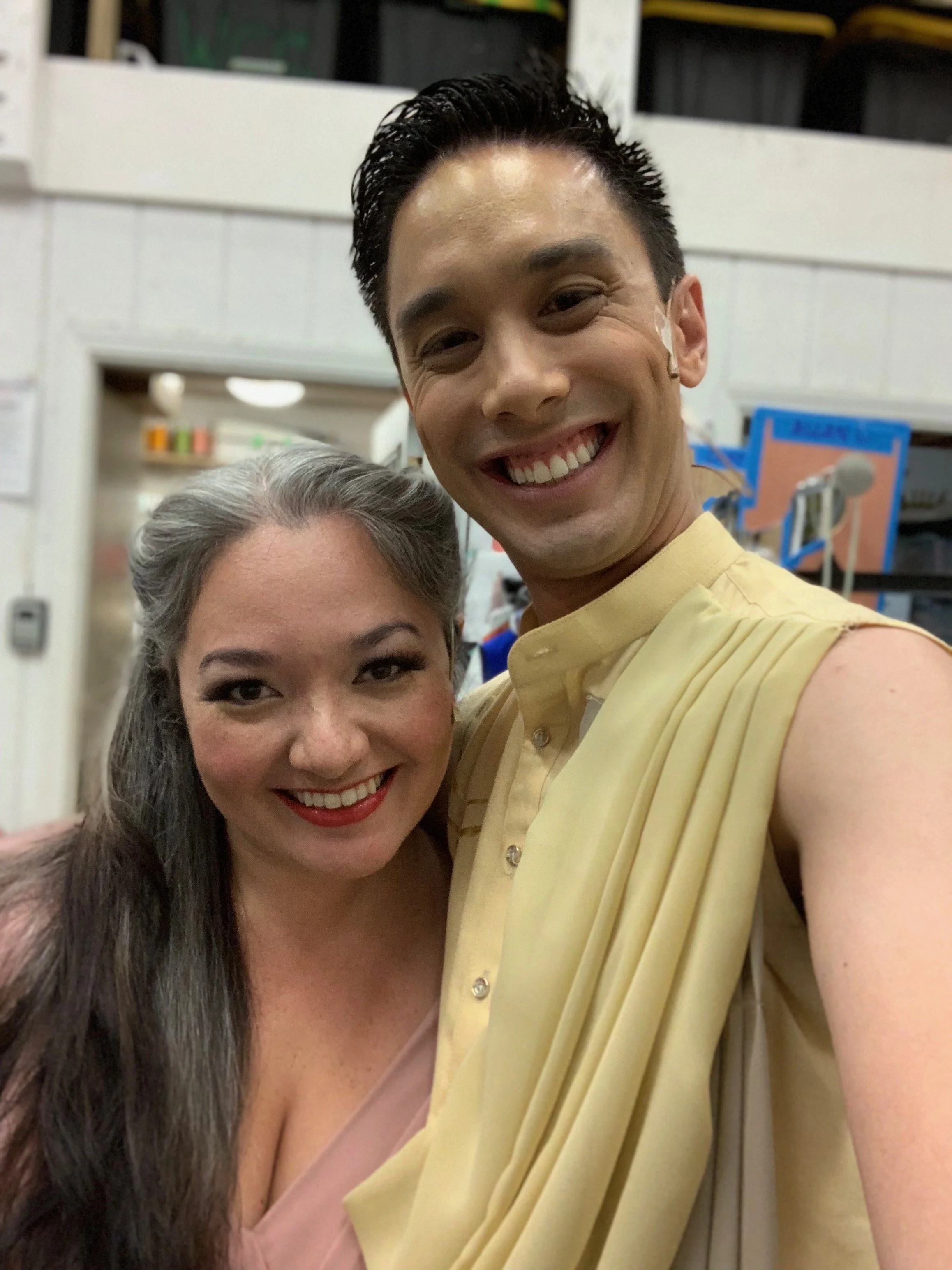 CHILDREN OF EDEN a Broadway musical by I'm A Bright Kid Foundation at Paliku Theatre. A smiling man and woman taking a selfie together indoors.