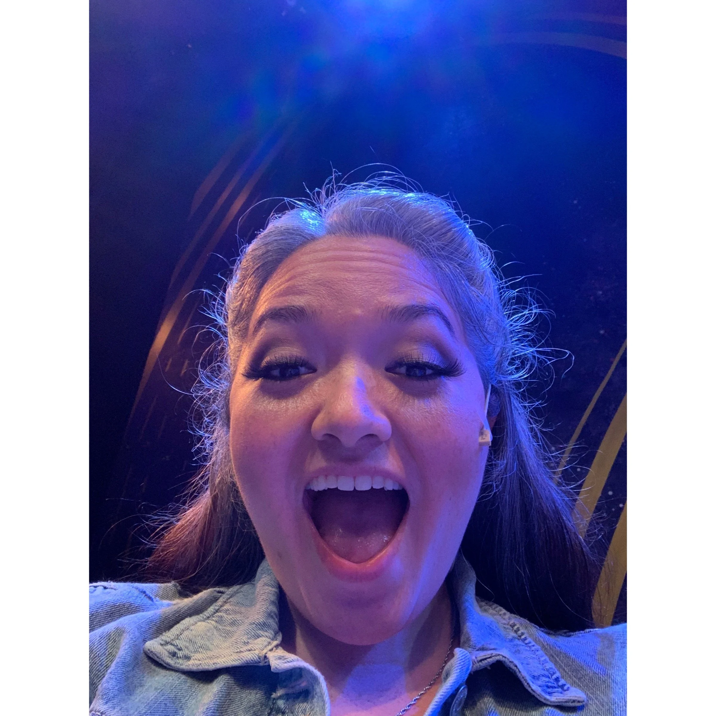 CHILDREN OF EDEN a Broadway musical by I'm A Bright Kid Foundation at Paliku Theatre. A woman with brown hair and makeup, smiling widely with her mouth open in a joyful expression.