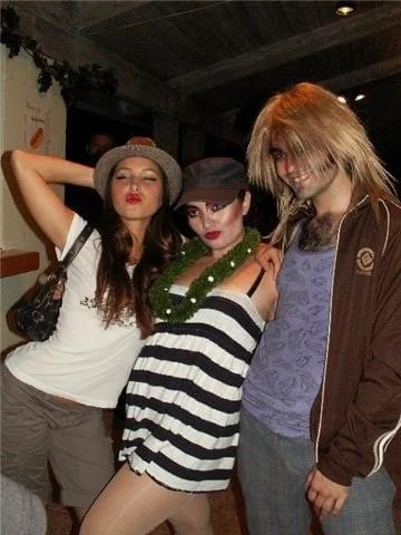 ROCKY HORROR SHOW cast party at Manoa Valley Theatre. Actress Cassie Favreau-Chung plays Magenta. Three people dressed as horror movie characters, posing together indoors at night.