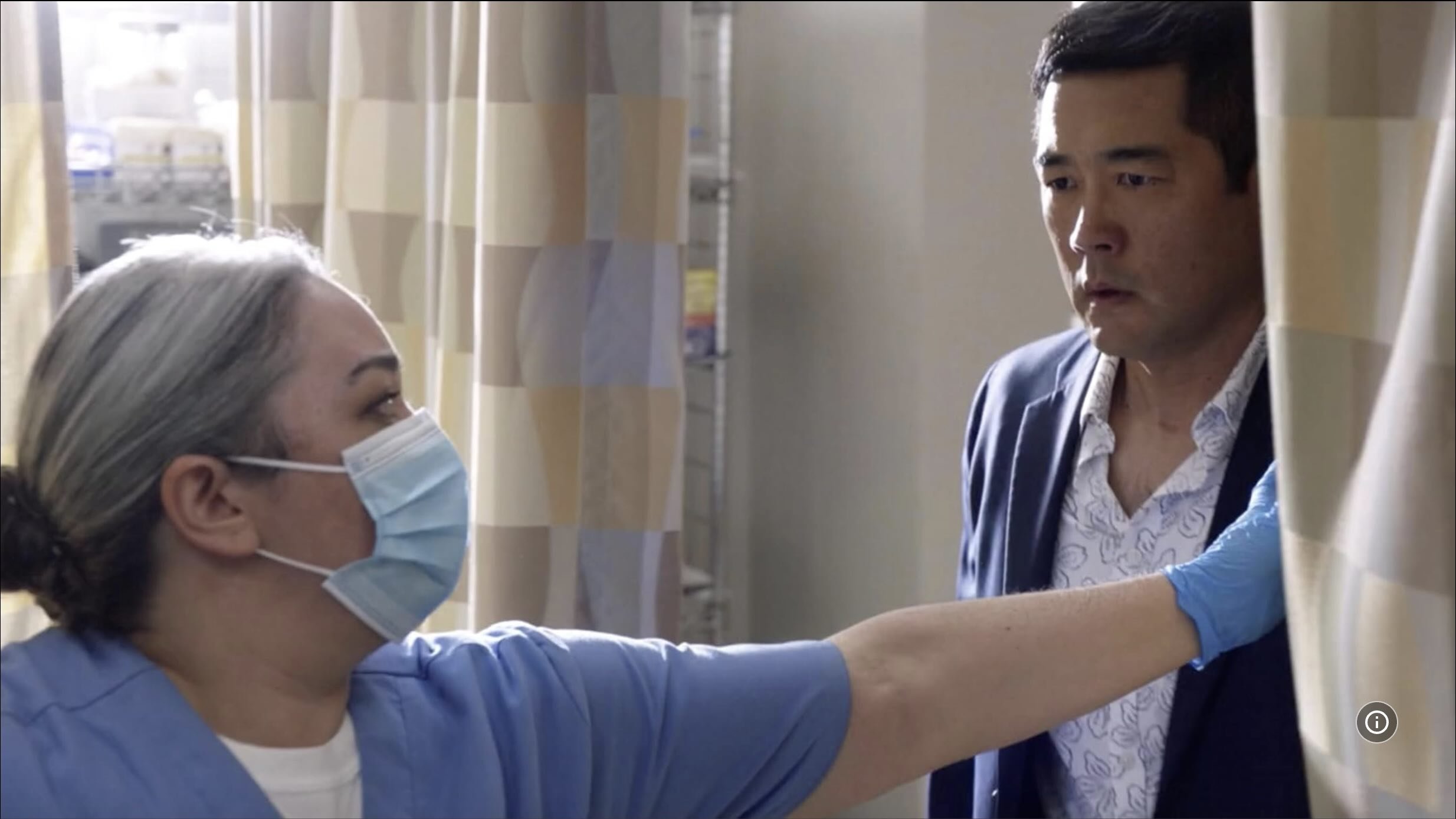 On the film set filming for MAGNUM P.I. with CBS on the studio lot in Honolulu, Hawaii. SAG-AFTRA actress, Cassie Favreau-Chung, acting with Tim Kang during a heated scene in the hospital.