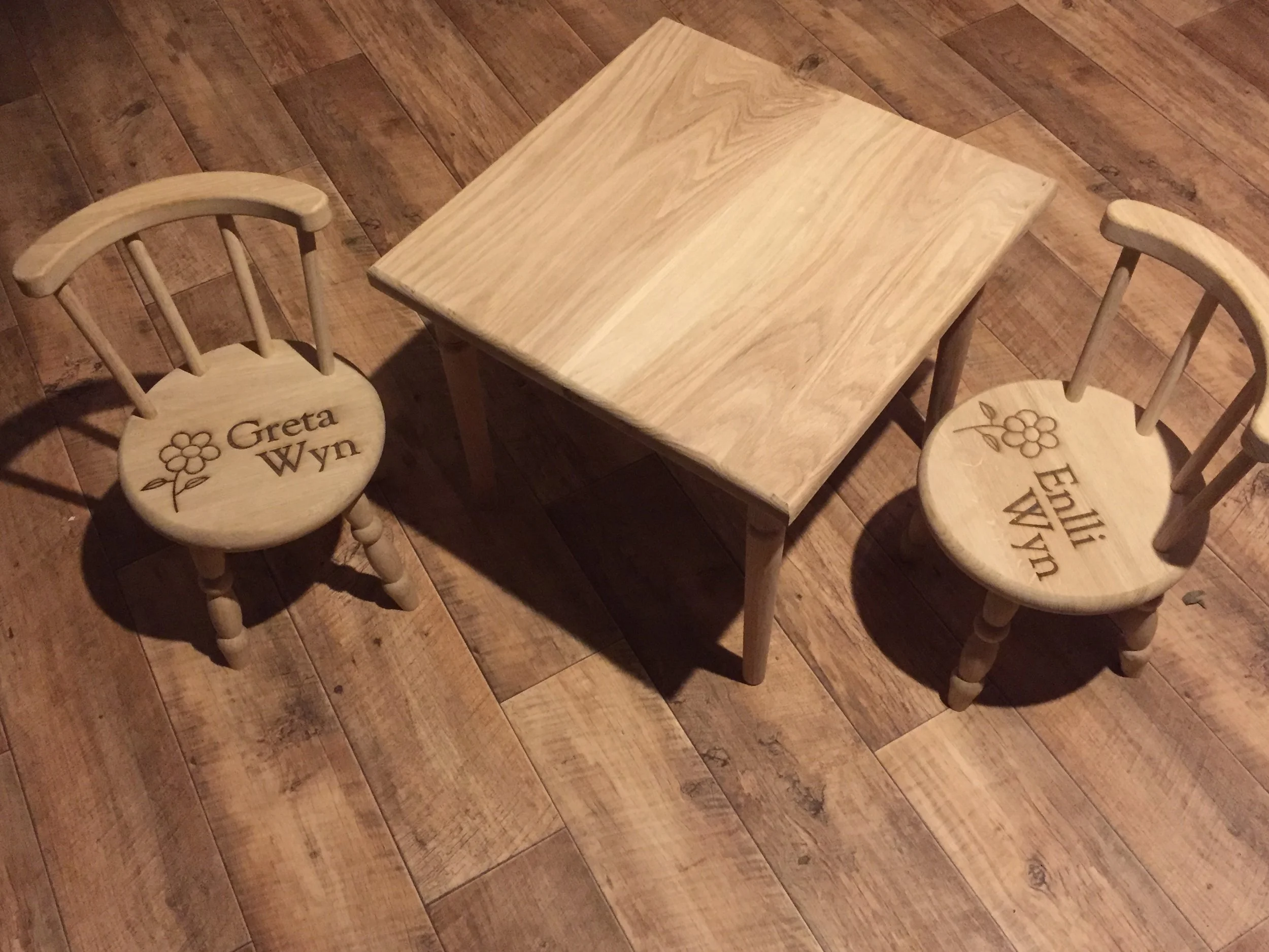 Two children's chairs and table. Oak. £210
