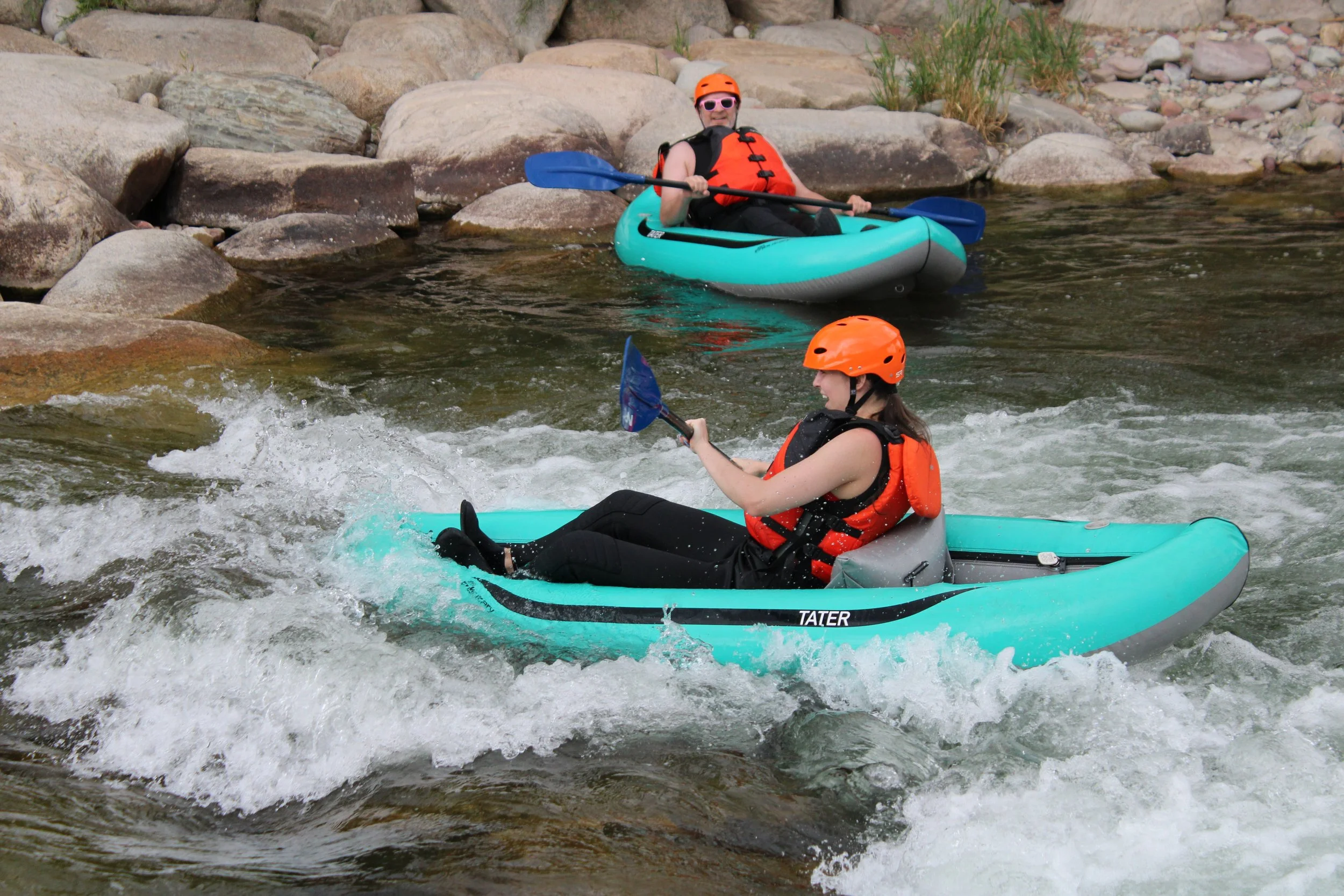 surfing in an inflatable kayak