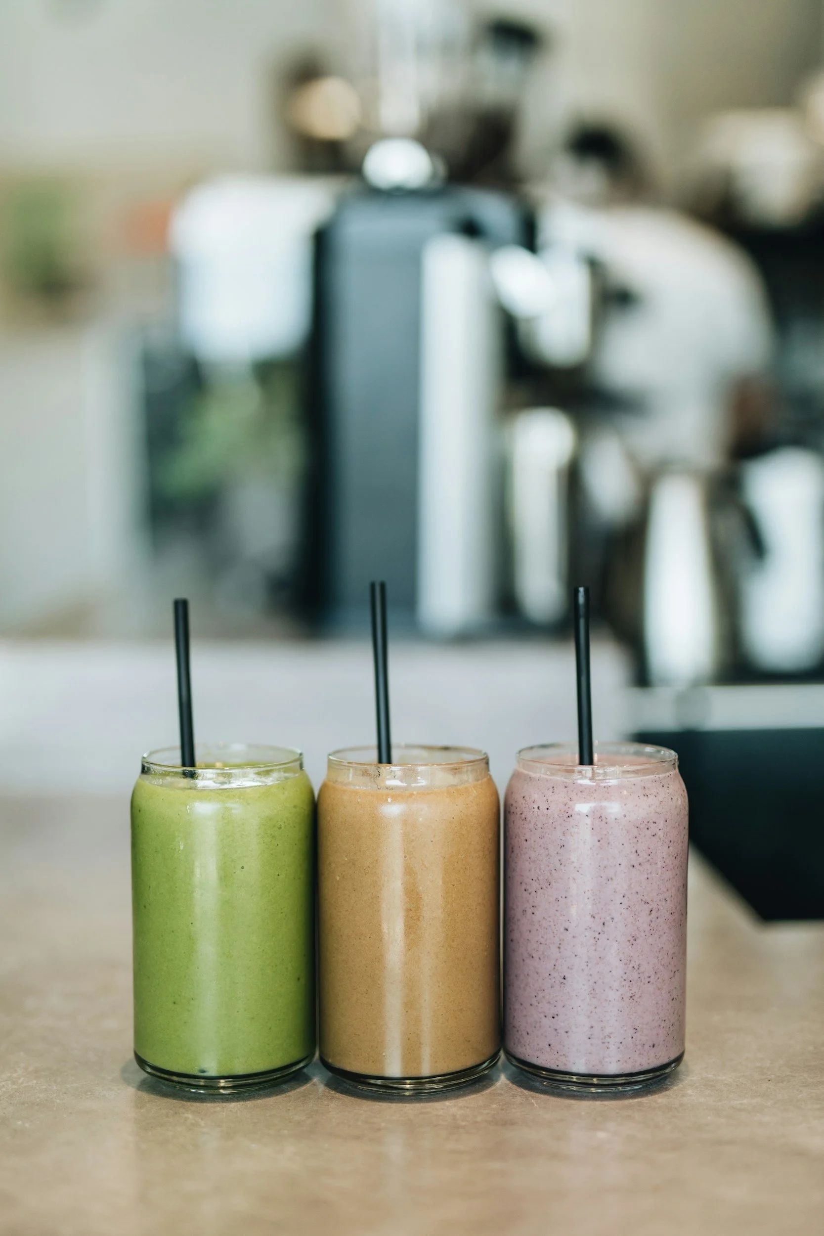 Three smoothies in glass jars 