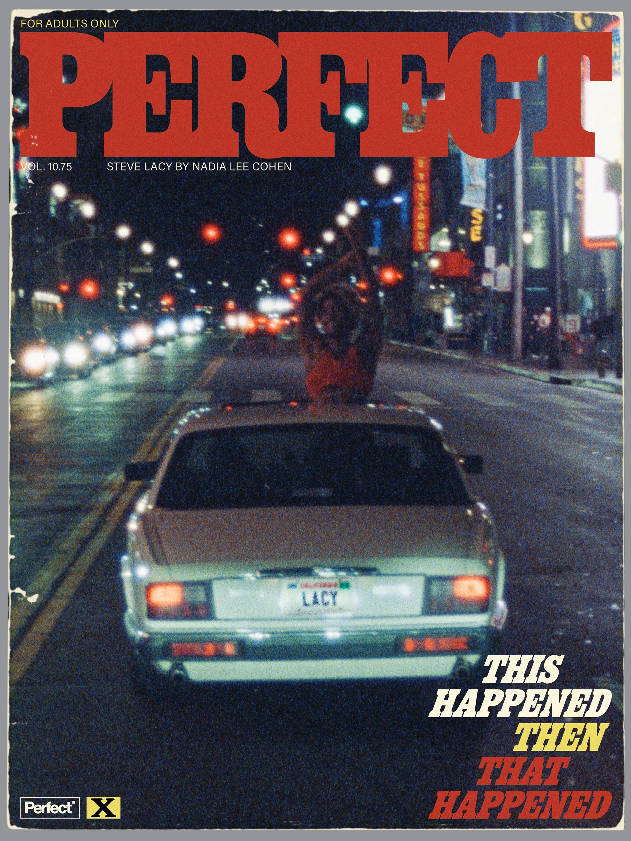 City street at night with cars and a car with a personalized license plate reading 'LACY'. The scene includes illuminated signs and traffic lights.