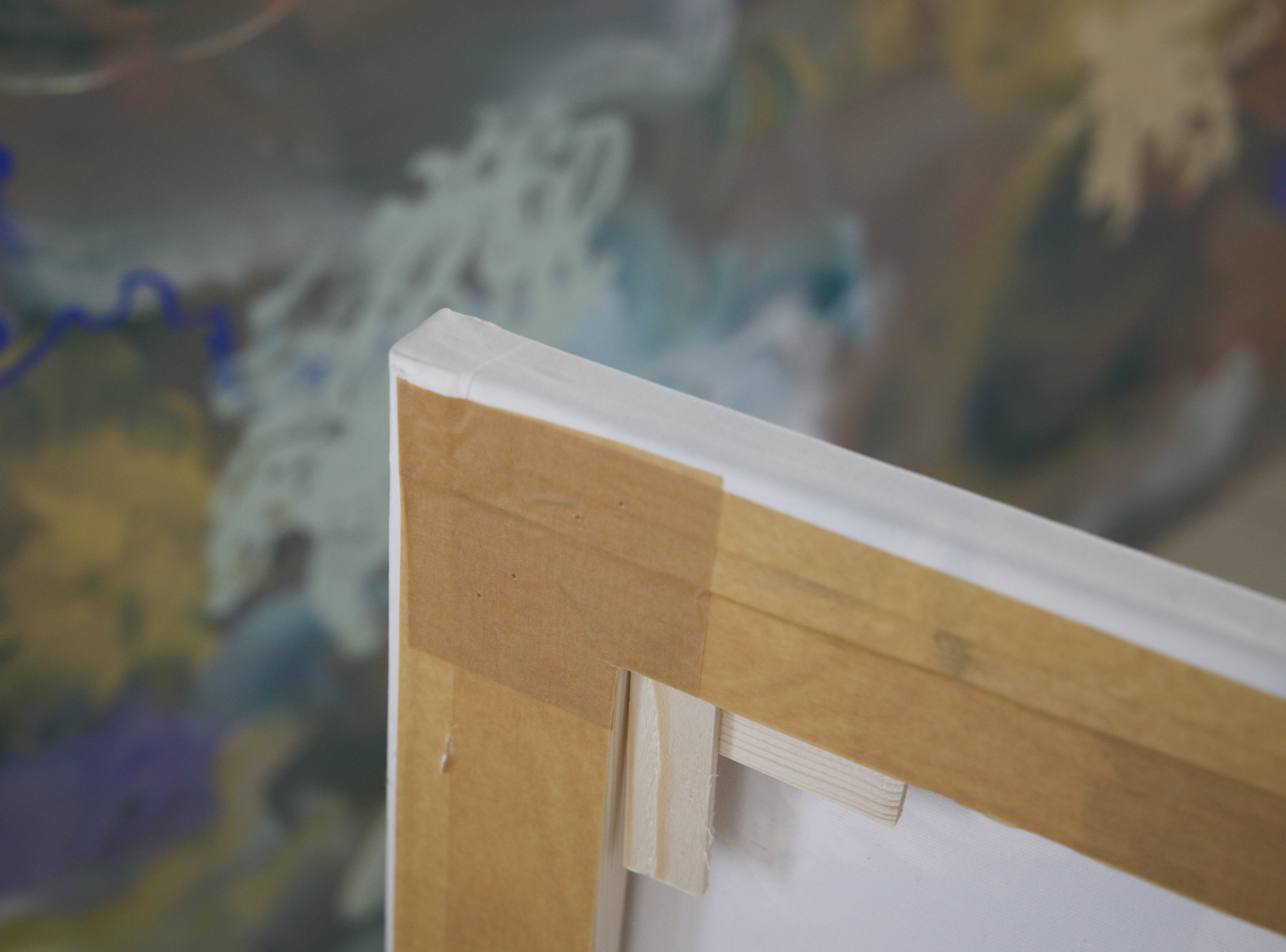 Back of a large canvas with pine cross brace and corner keys