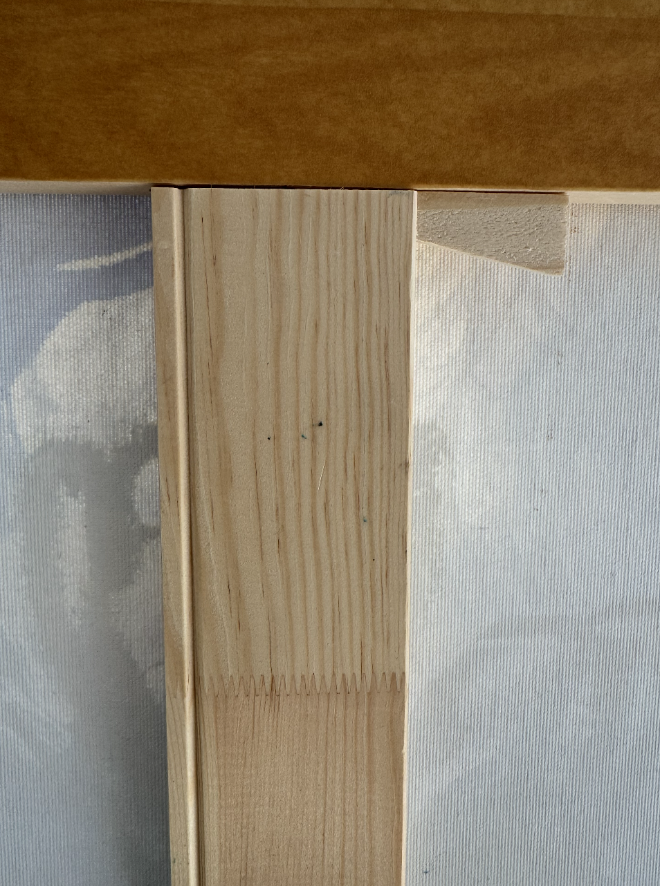 Wooden corner key on a stretcher bar