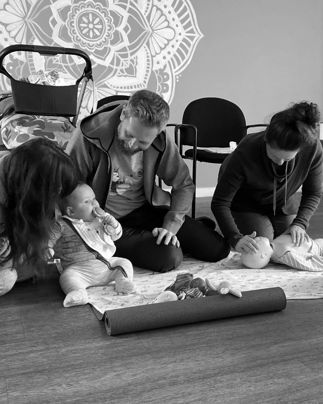 Parents attending a baby first aid class