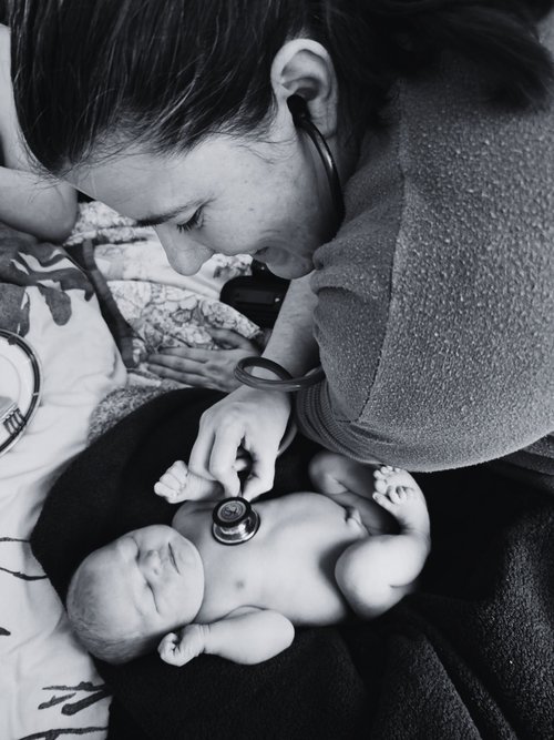 Lee cuddling her newborn