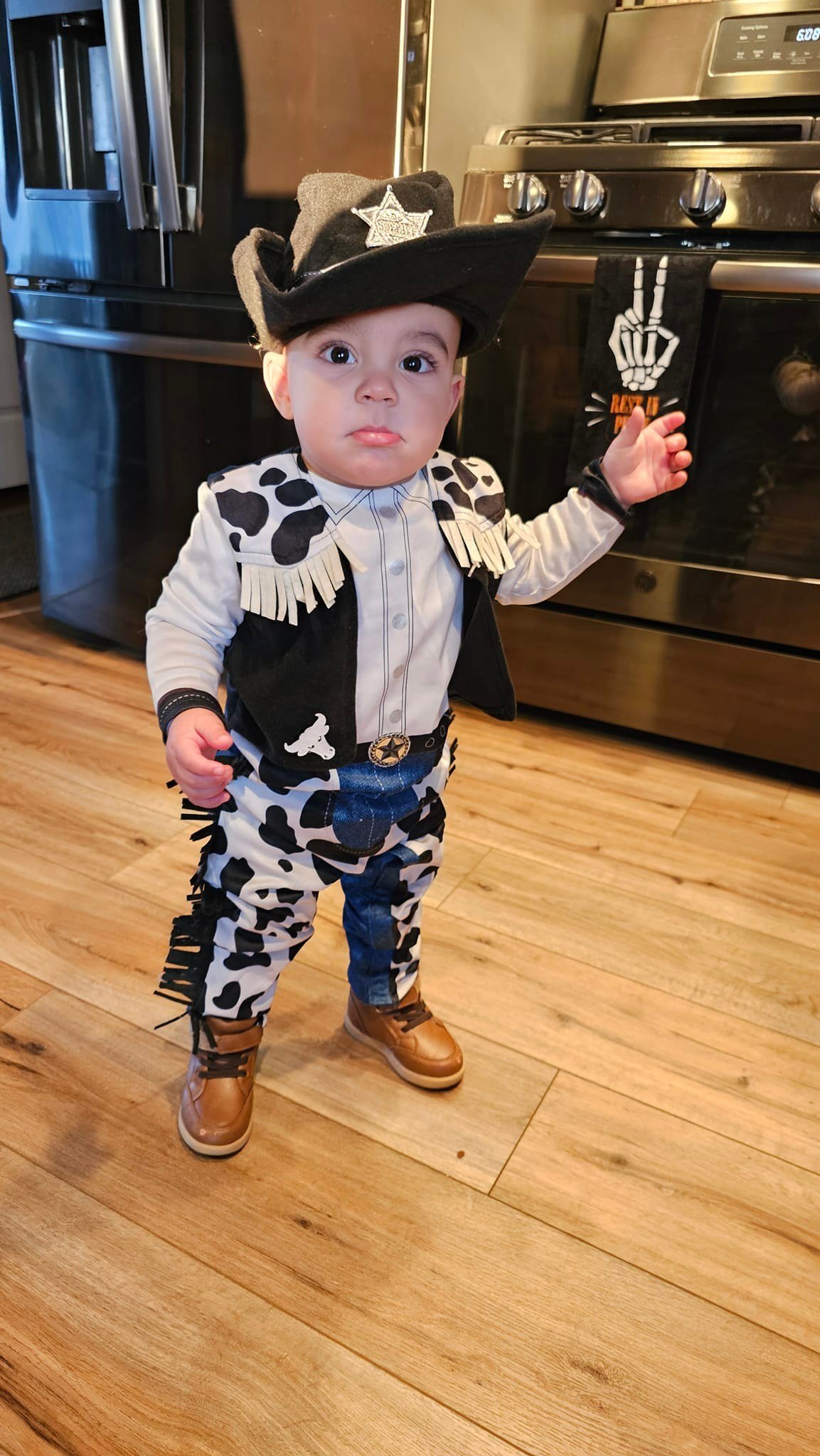My grandson came to our Halloween bash ready to party. He's walking at 1 year old. This little guy is the cutest.