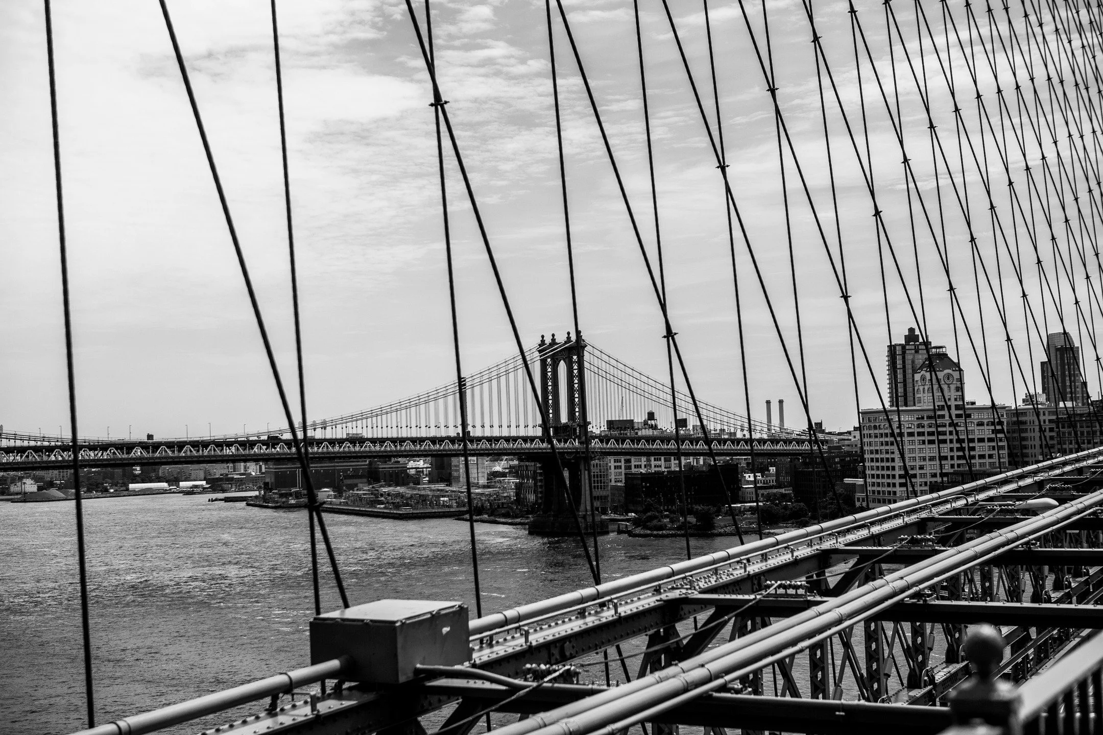 Standing on the Brooklyn Bridge, New York City.

#newyorkcity #nyc #manhattan #streetphotography #photography #canonr #canonphotography #shotoncanon 
#blackandwhite #blackandwhitephotography #bridge #brooklynbridge #manhattanbridge