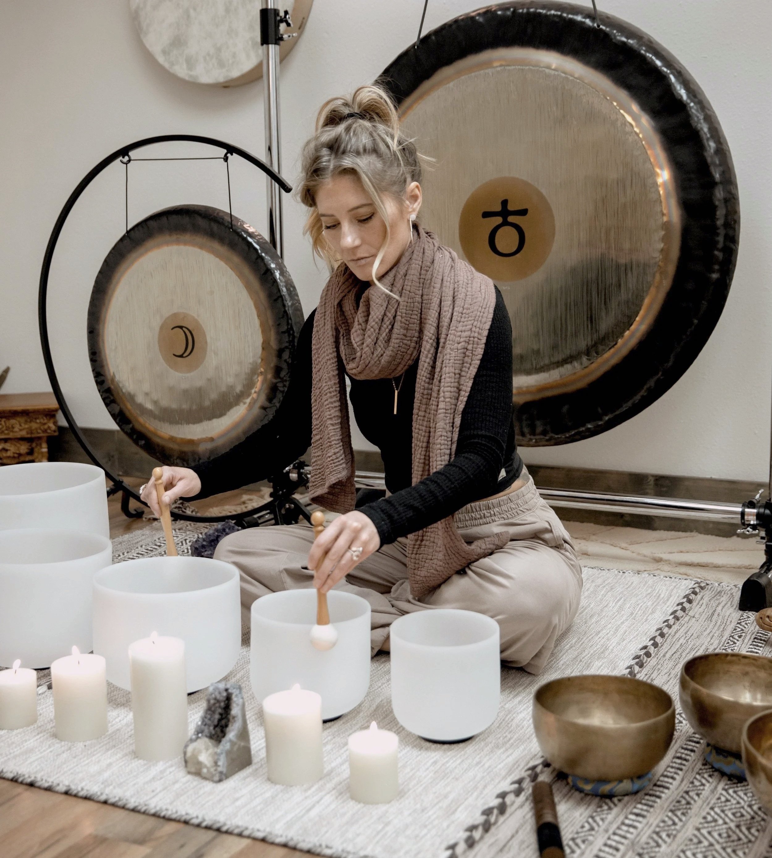 Alison playing crystal quarts singing bowls in Breckenridge, Colorado
