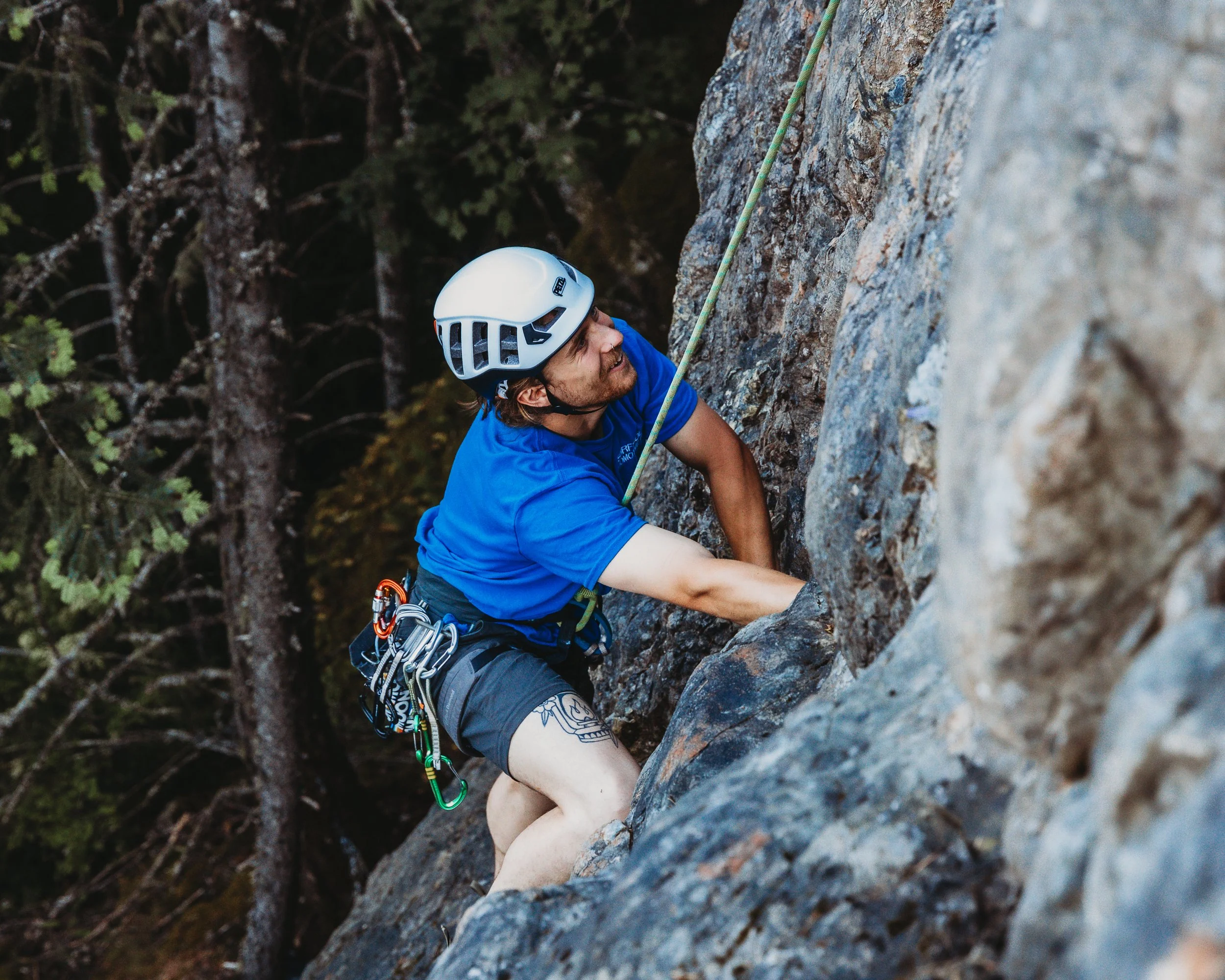 Man in a blue shirt rock climbing on Mount Benson, Nanaimo BC, Dylan Phillips Photography