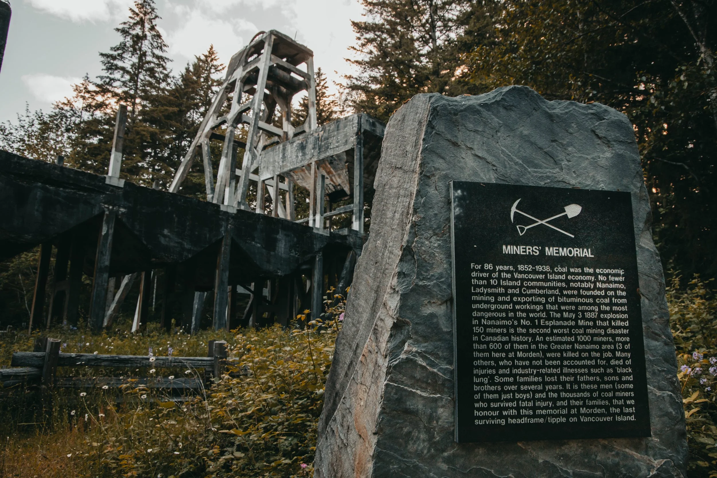 A memorial cairn placed in front of the Morden Colliery Historic concrete headframe, Nanaimo BC, Vancouver Island, Canada