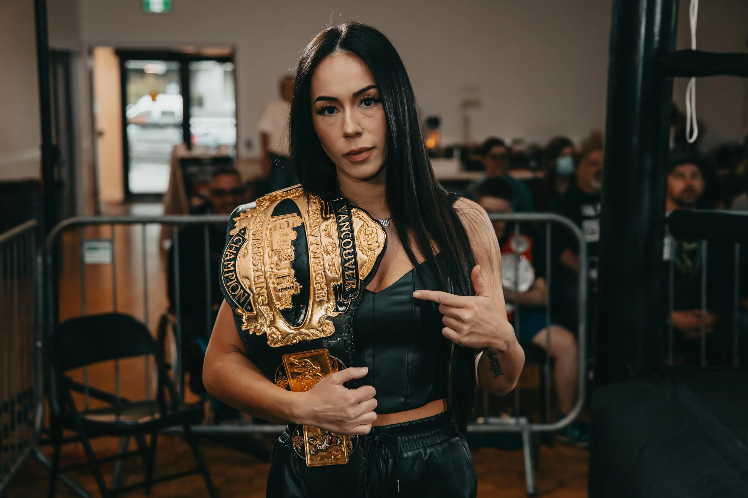 The Priestess Lee shows off the Vancouver Championship belt while ringside - Vancouver Island Pro Wrestling, Dylan Phillips Photography