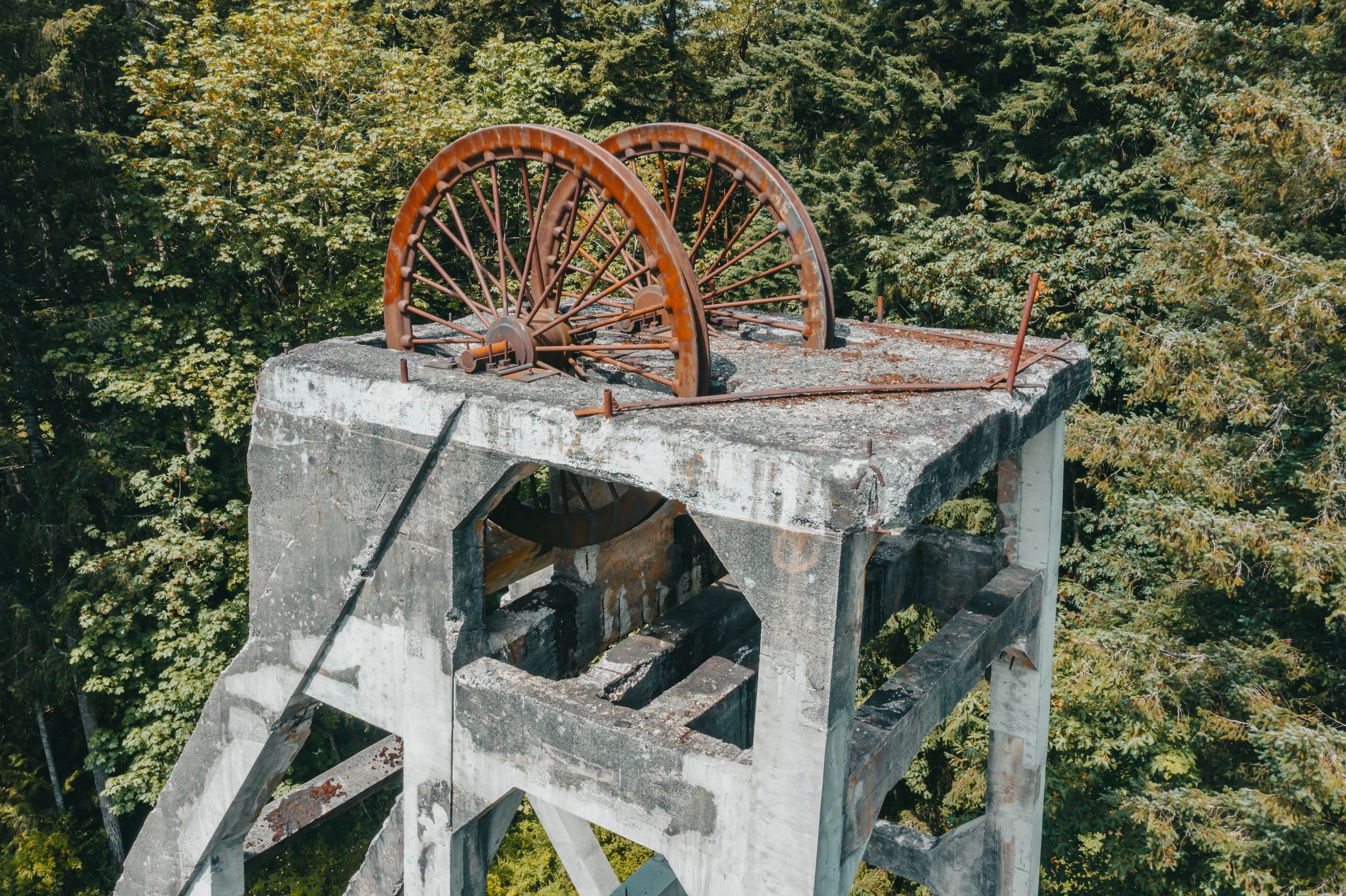 close up of rusty cable drive pulley at the top of Morden Mine concrete headframe