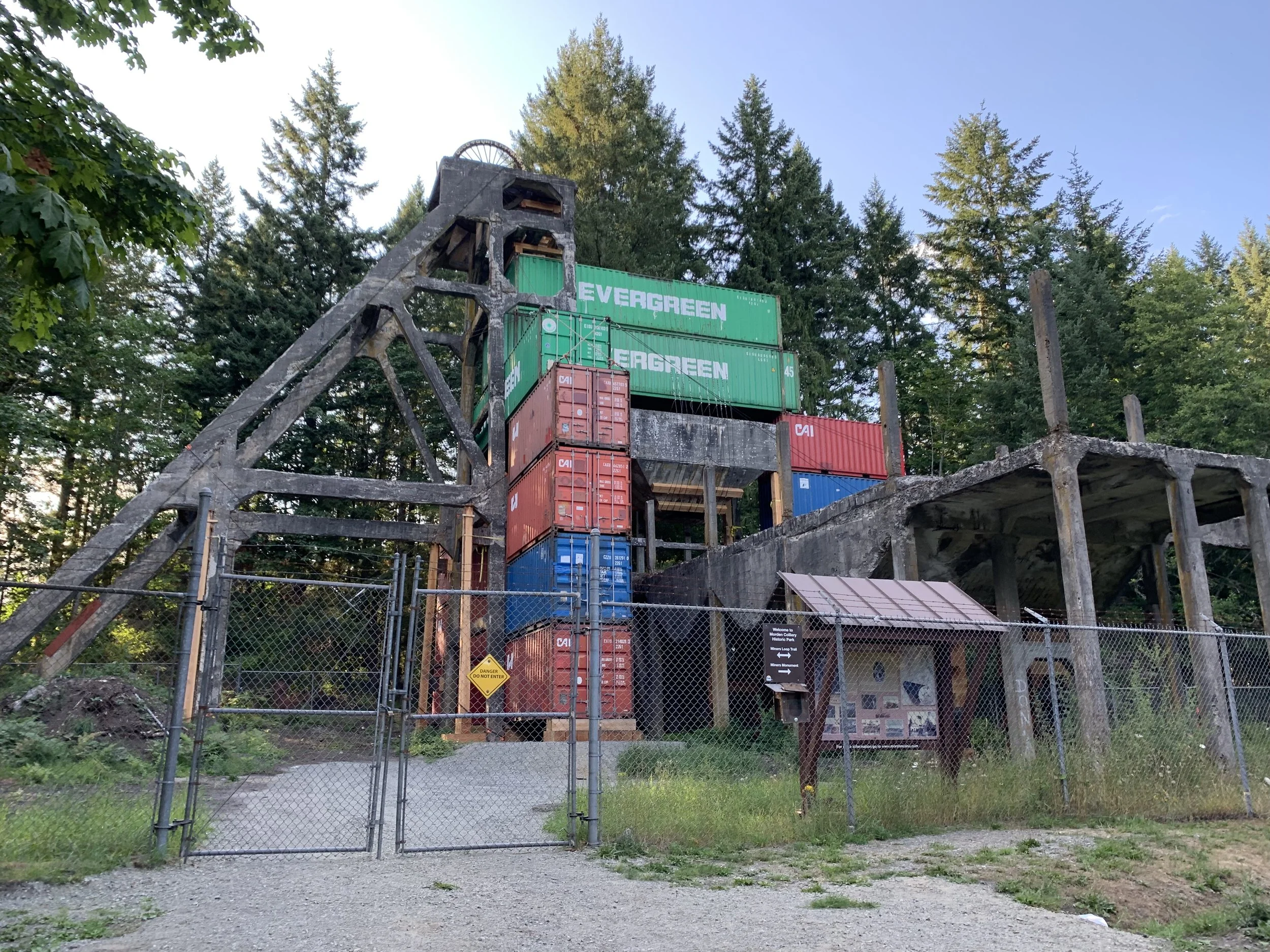 Morden mine historic concrete headframe being supported by shipping containers during a concrete restoration project in 2019
