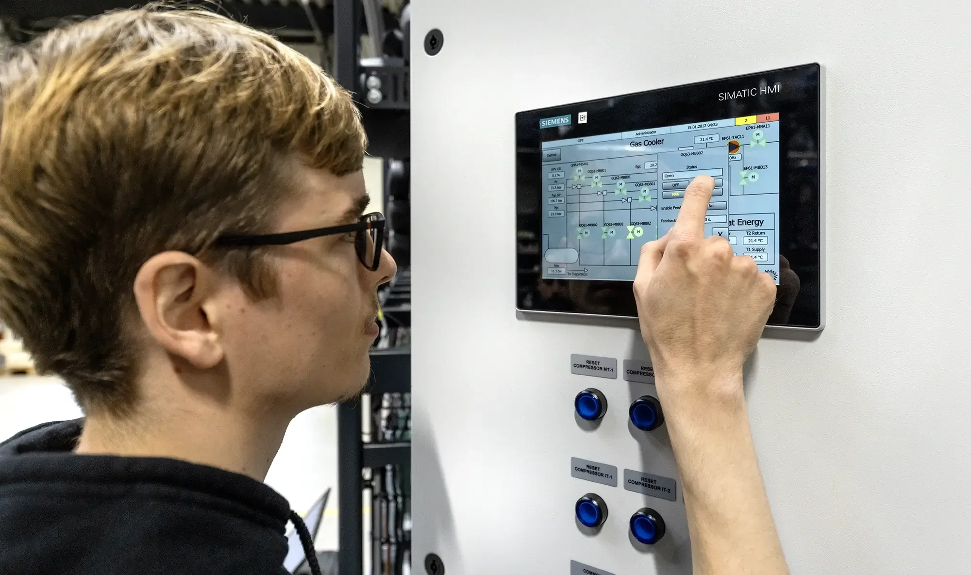 Man controlling screen on heat pump