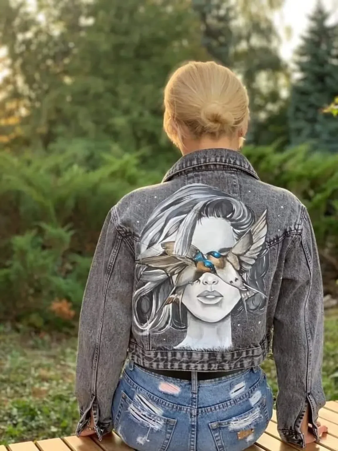 Custom hand-painted denim jacket with detailed artwork on the back
