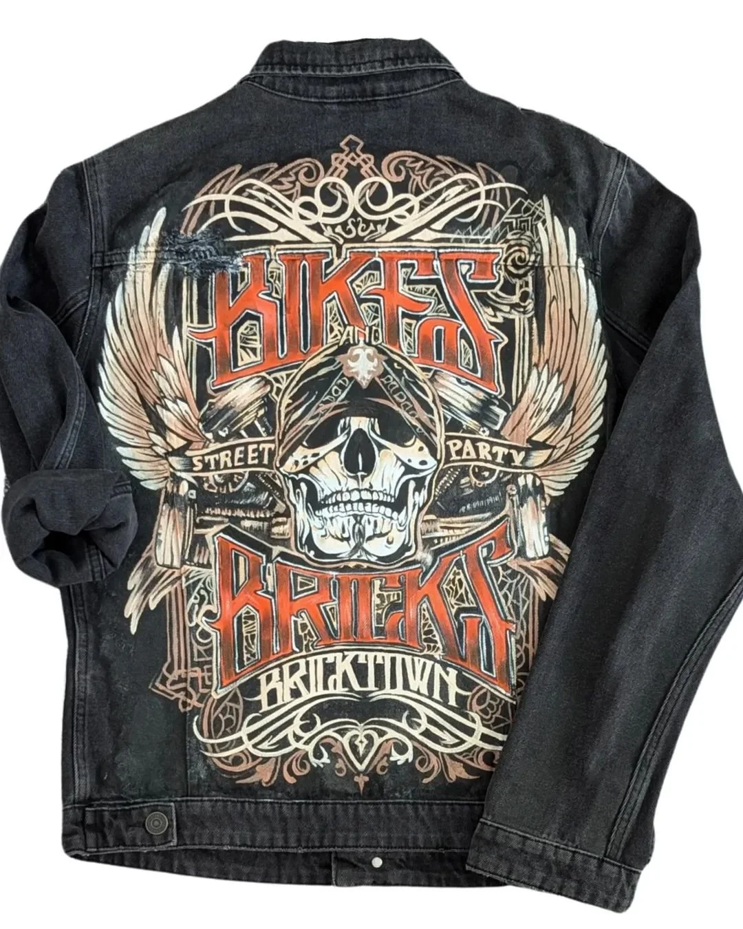 Custom hand-painted denim jacket with skull artwork for bikers