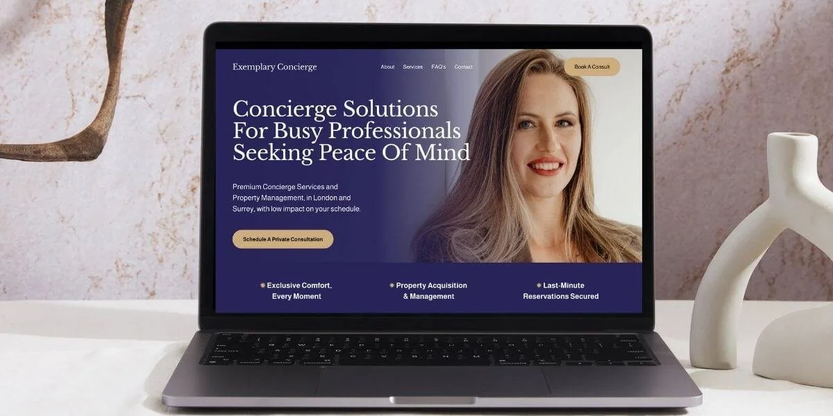 Luxury concierge hero section on a laptop screen with text: ‘Concierge solutions for busy professionals seeking peace of mind,' a call-to-action button, and a background image of a female professional smiling warmly.