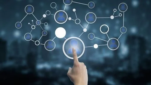 A hand touching a glowing node in a digital network, representing the strategic placement of internal links to guide users and search engines within a website for improved SEO.