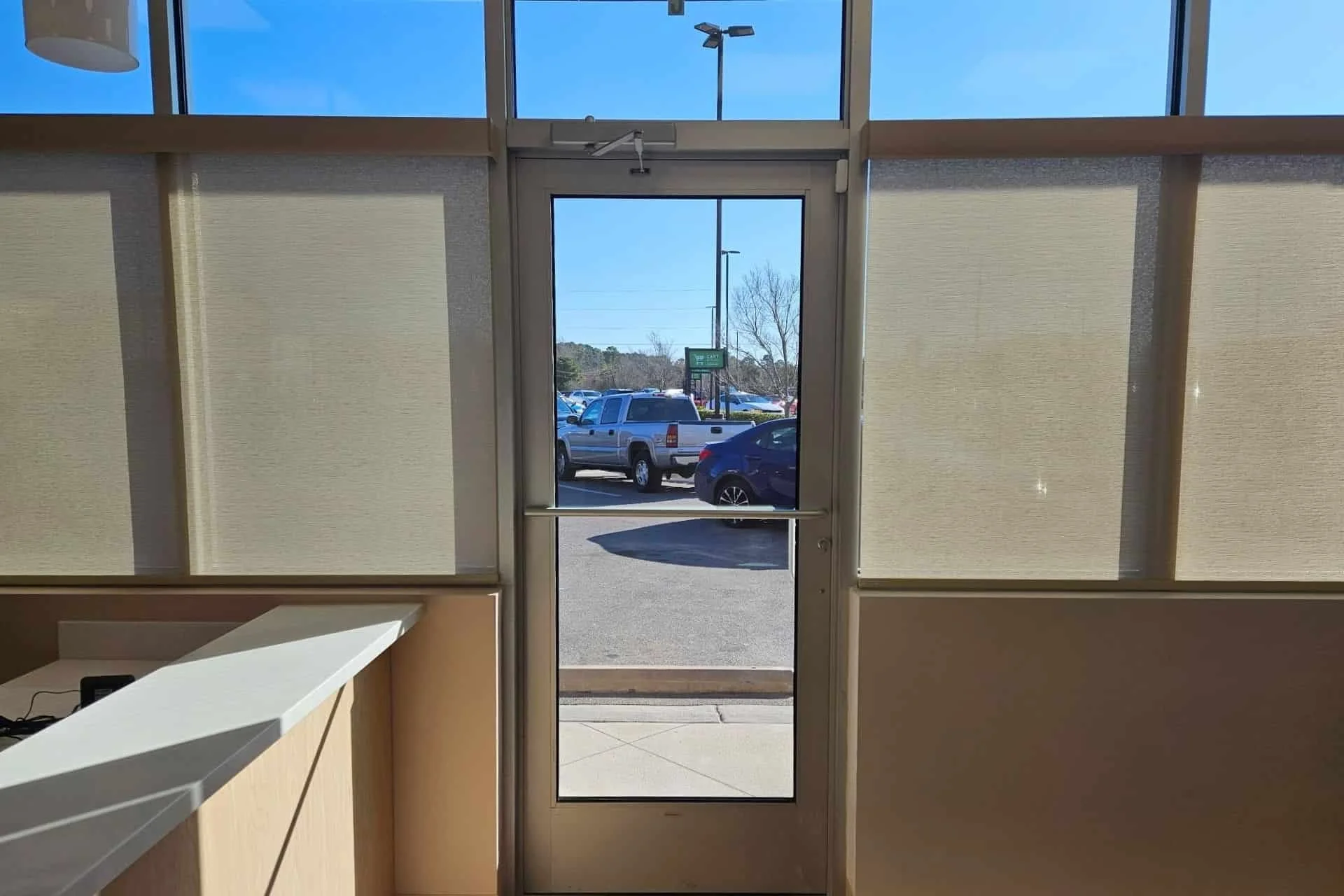 Motorized blinds in an office next to the entrance door in Surf City, NC