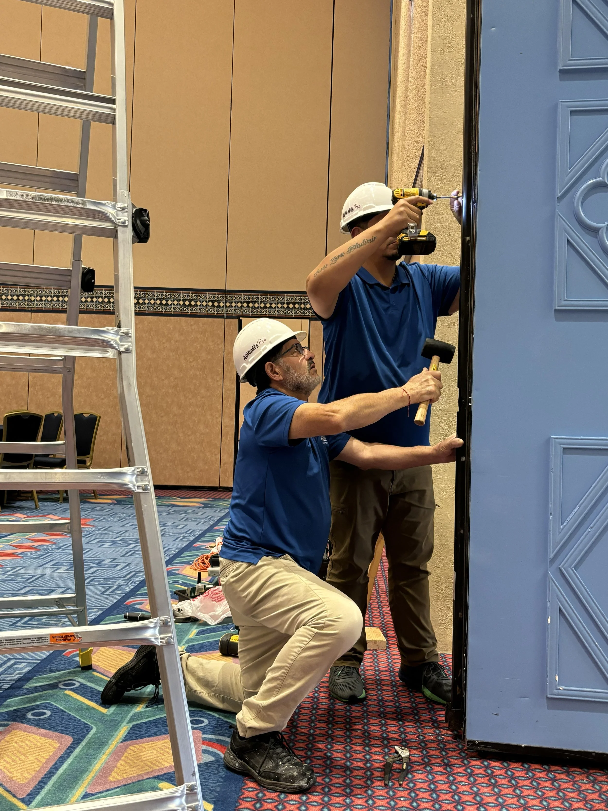 Technician repairing operable partition system