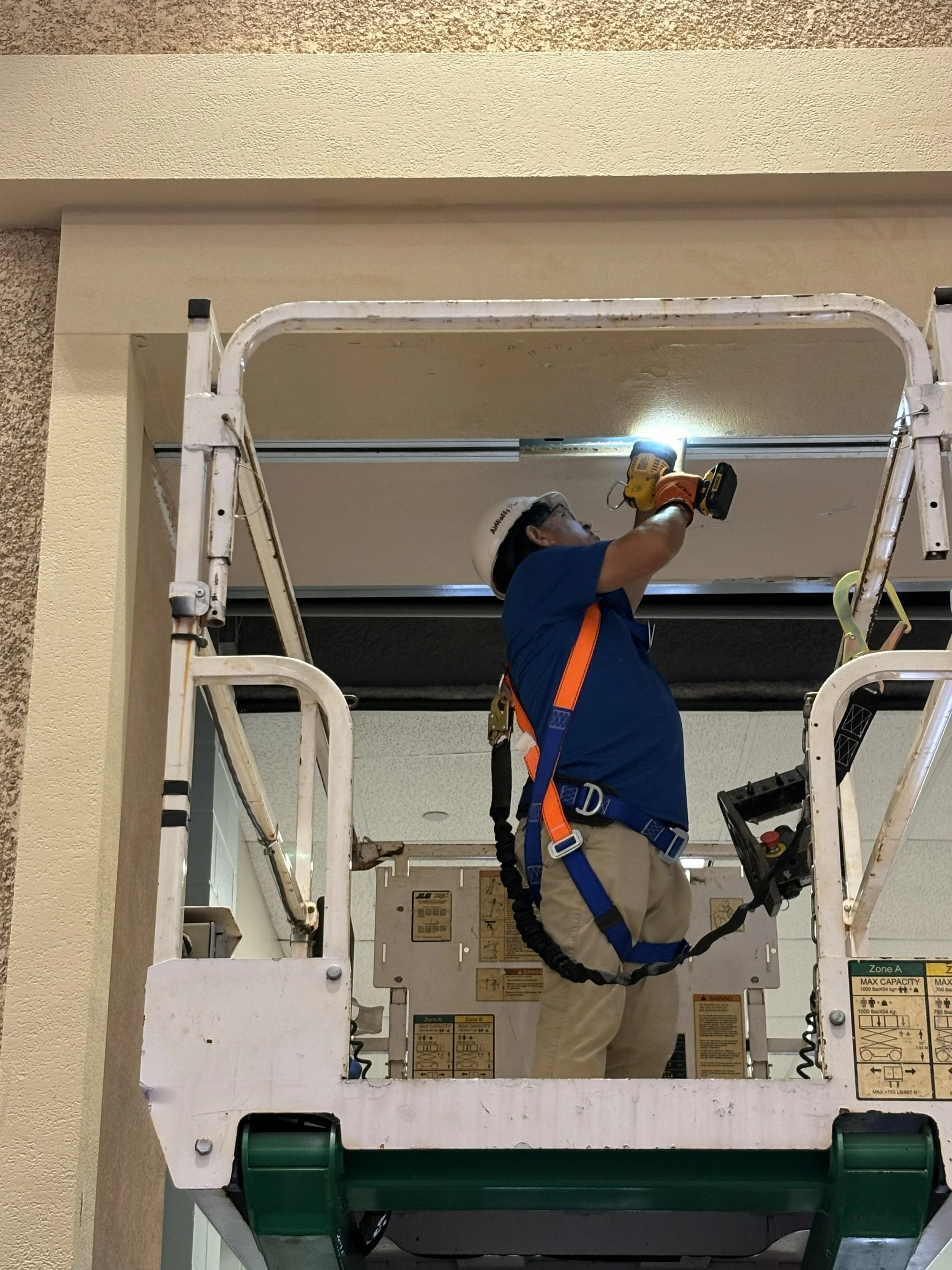 Technician repairing operable partition system