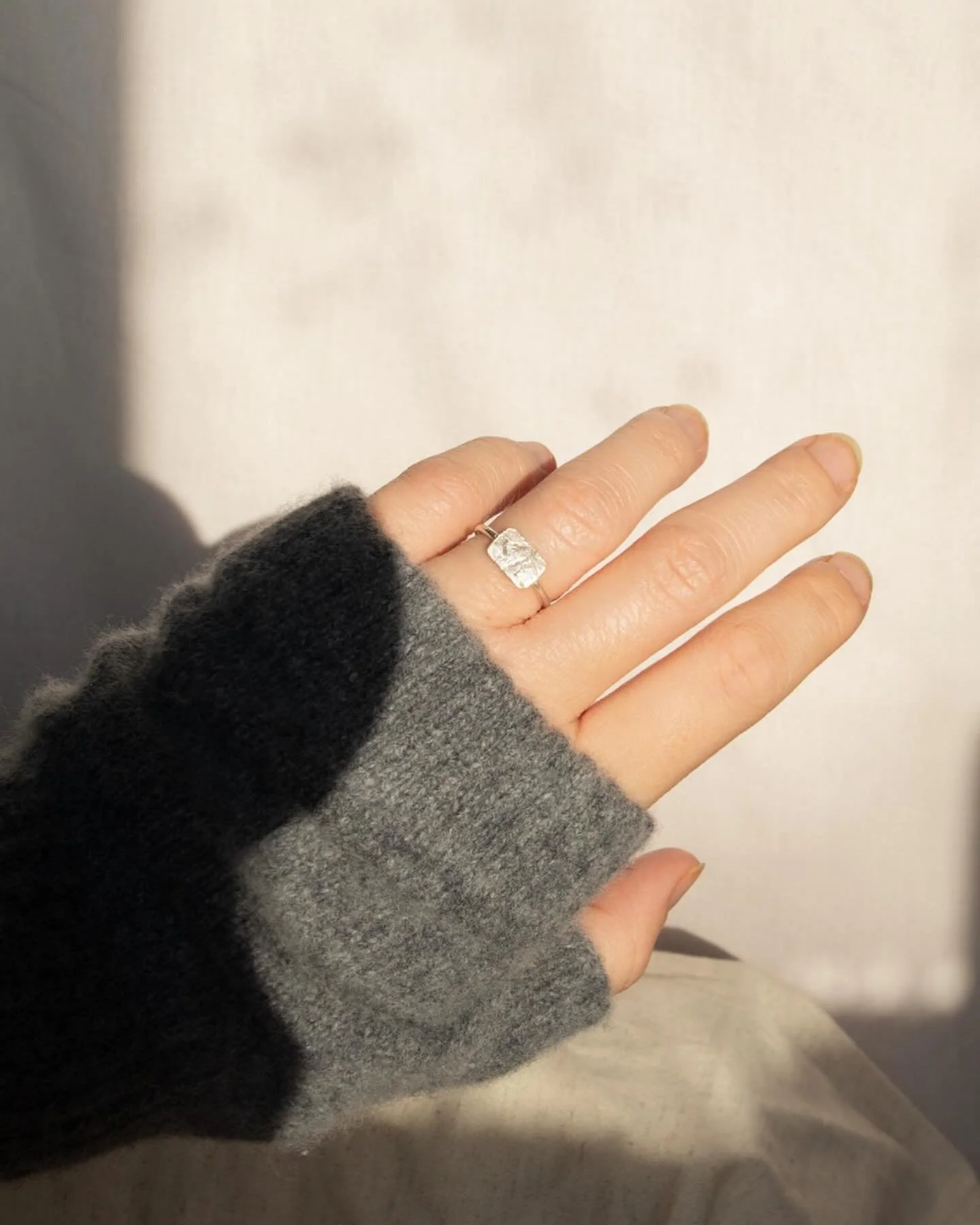 This is one of the first rings I ever attempted to make, and I still wear it to this day.

Like the earrings from my last post, the silver plate has been textured by stones from Newgale Beach (one of my most beloved places), going on to be set onto a
